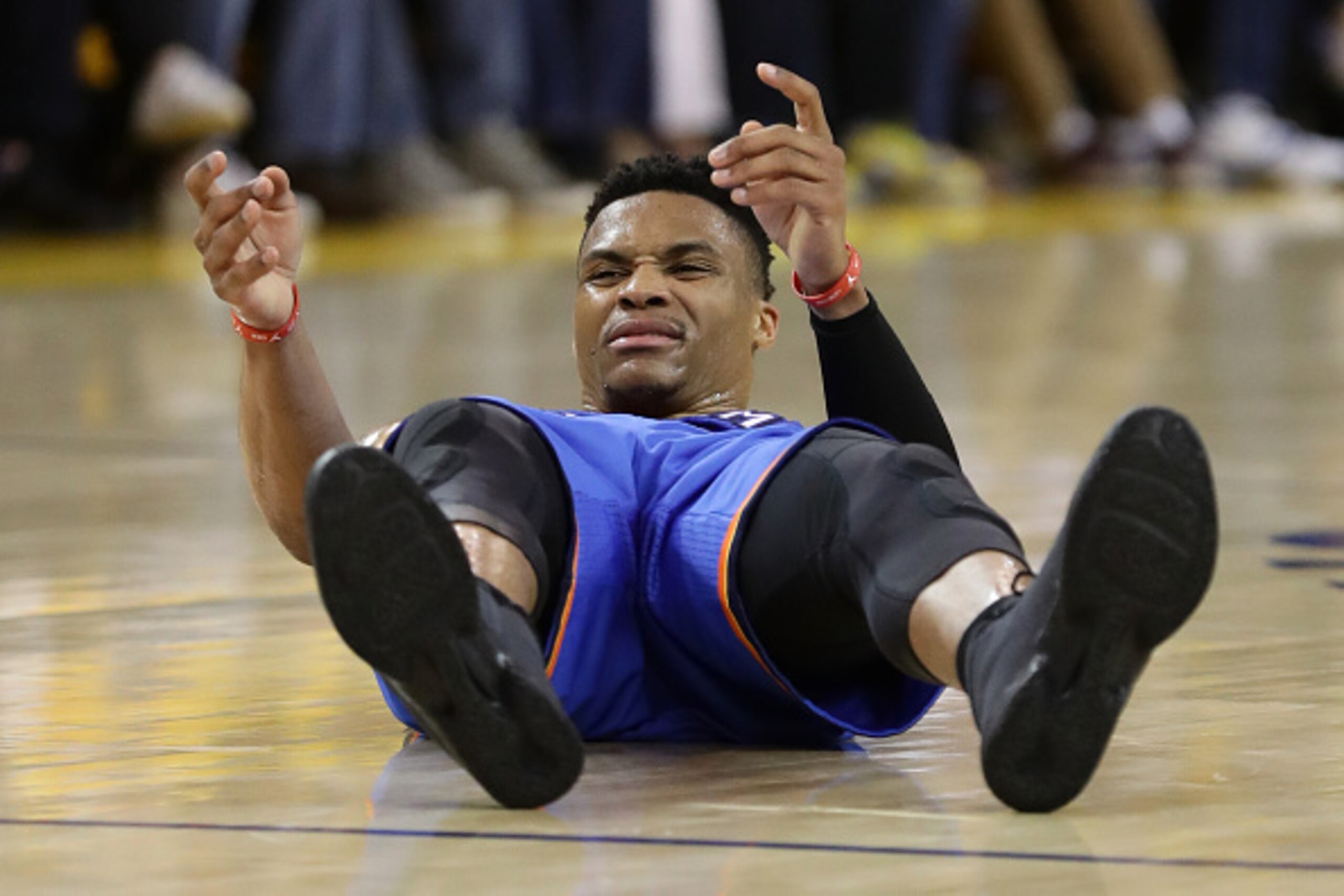 OAKLAND, CA - MAY 30:  Russell Westbrook #0 of the Oklahoma City Thunder lays on the court after a play in Game Seven of the Western Conference Finals against the Golden State Warriors during the 2016 NBA Playoffs at ORACLE Arena on May 30, 2016 in Oaklan