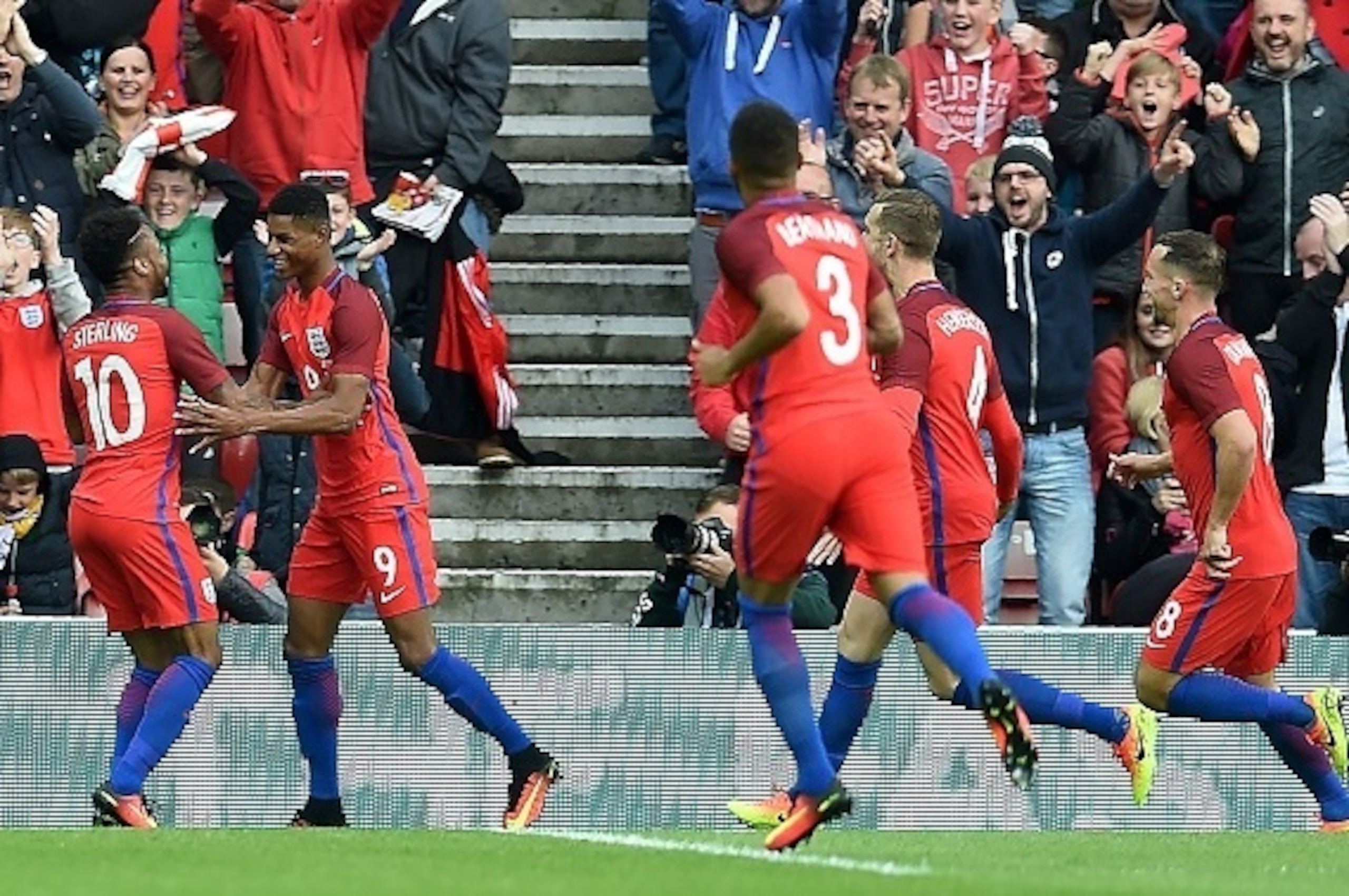 England's striker Marcus Rashford (2nd L) celebrates after scoring his team's second goal during the friendly football match between England and Australia at the Stadium of Light in Sunderland, north east England, on May 27, 2016. / AFP / PAUL ELLIS / NOT