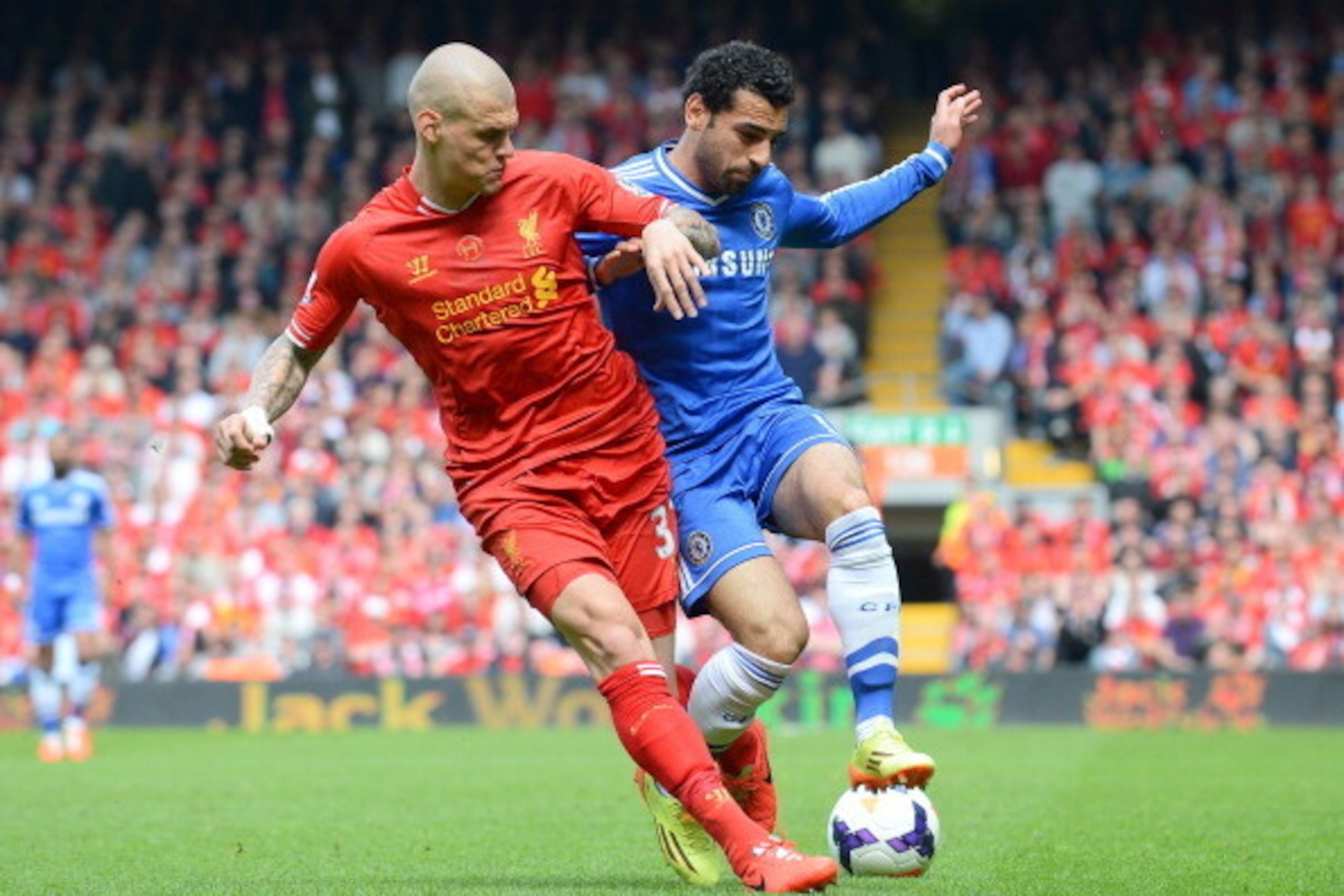 Liverpool's Slovakian defender Martin Skrtel (L) vies for the ball with Chelsea's Egyptian midfielder Mohamed Salah during the English Premier League football match between Liverpool and Chelsea at Anfield Stadium in Liverpool, northwest England, on April
