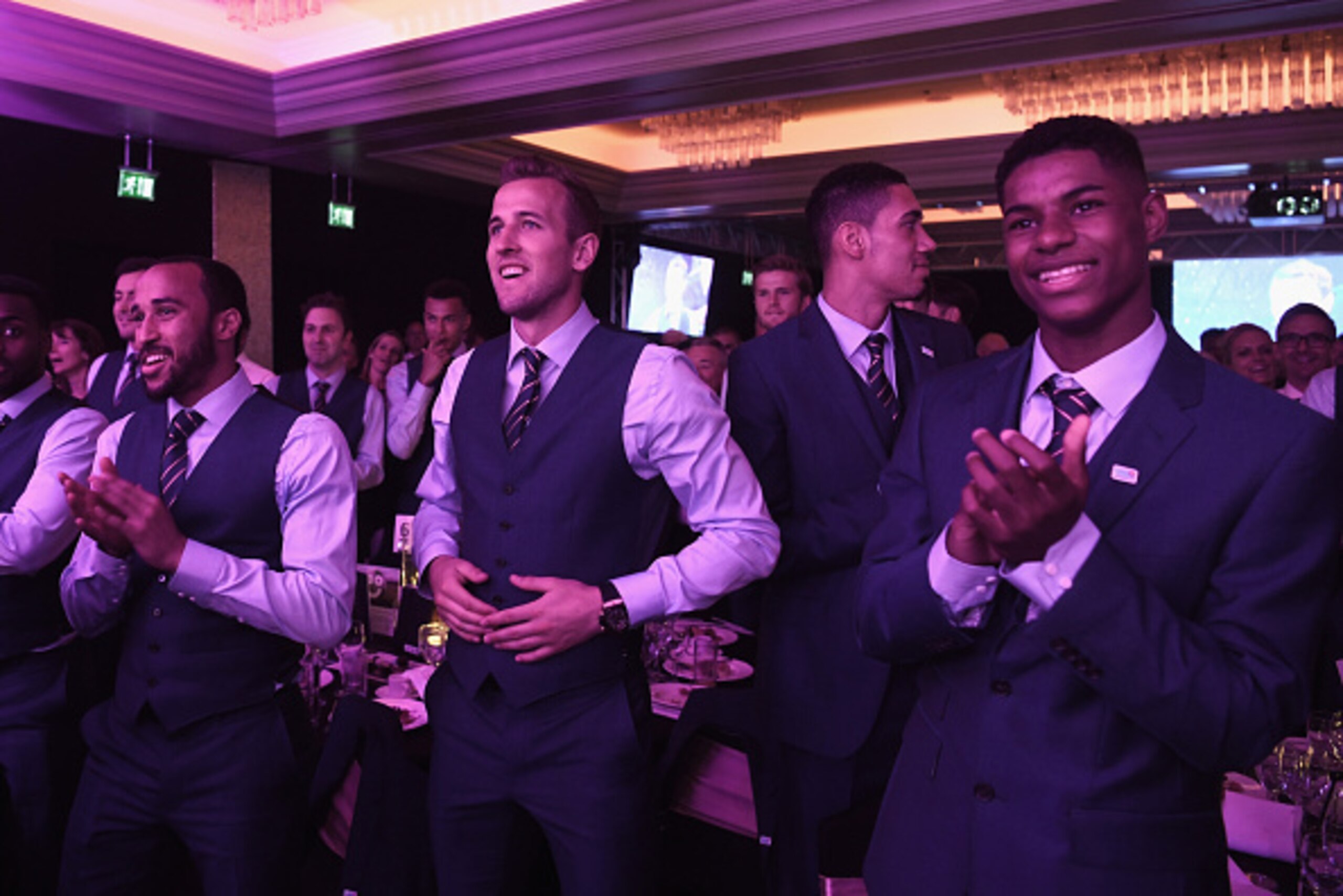 ST ALBANS, ENGLAND - MAY 29: Andros Townsend, Harry Kane, Chris Smalling and Marcus Rashford look on as Wayne Rooney and James Bay perform during the England Footballers Foundation charity event at Sopwell House on May 29, 2016 in St Albans, England.  (Ph