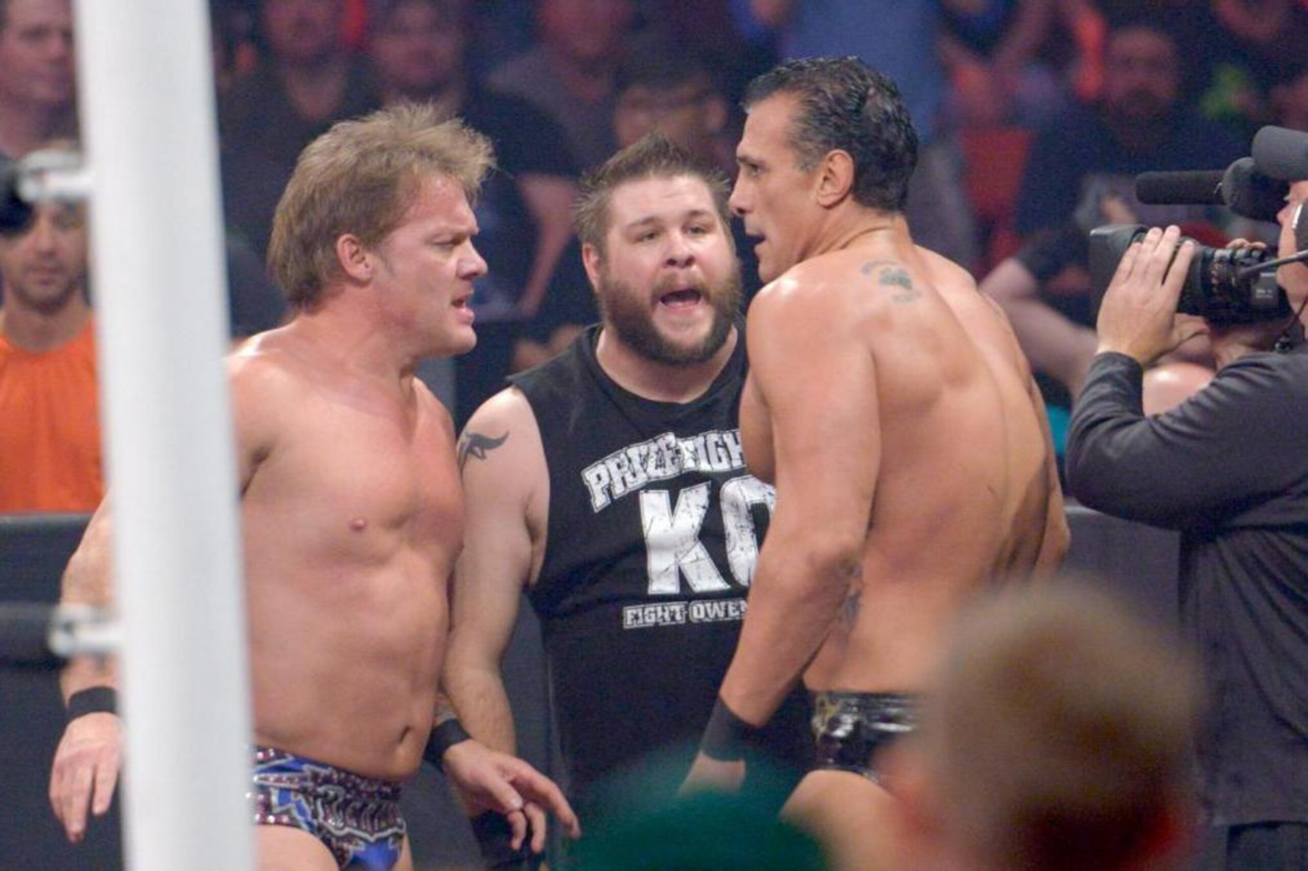 Chris Jericho, Kevin Owens and Alberto Del Rio look to regroup outside the ring.