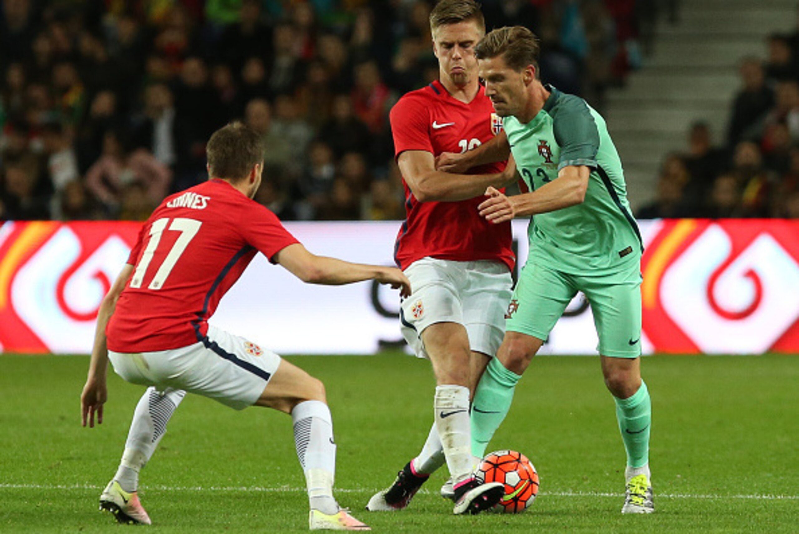 PORTO, PORTUGAL - MAY 29: Portugal midfielder Adrien Silva is tackled by Norway midfielder Markus Henriksen during the International Friendly match between Portugal and Norway at Estadio do Dragao on May 29, 2016 in Porto, Portugal. (Photo by Gualter Fa PORTO, PORTUGAL - MAY 29: Portugal midfielder Adrien Silva is tackled by Norway midfielder Markus Henriksen during the International Friendly match between Portugal and Norway at Estadio do Dragao on May 29, 2016 in Porto, Portugal. (Photo by Gualter Fa