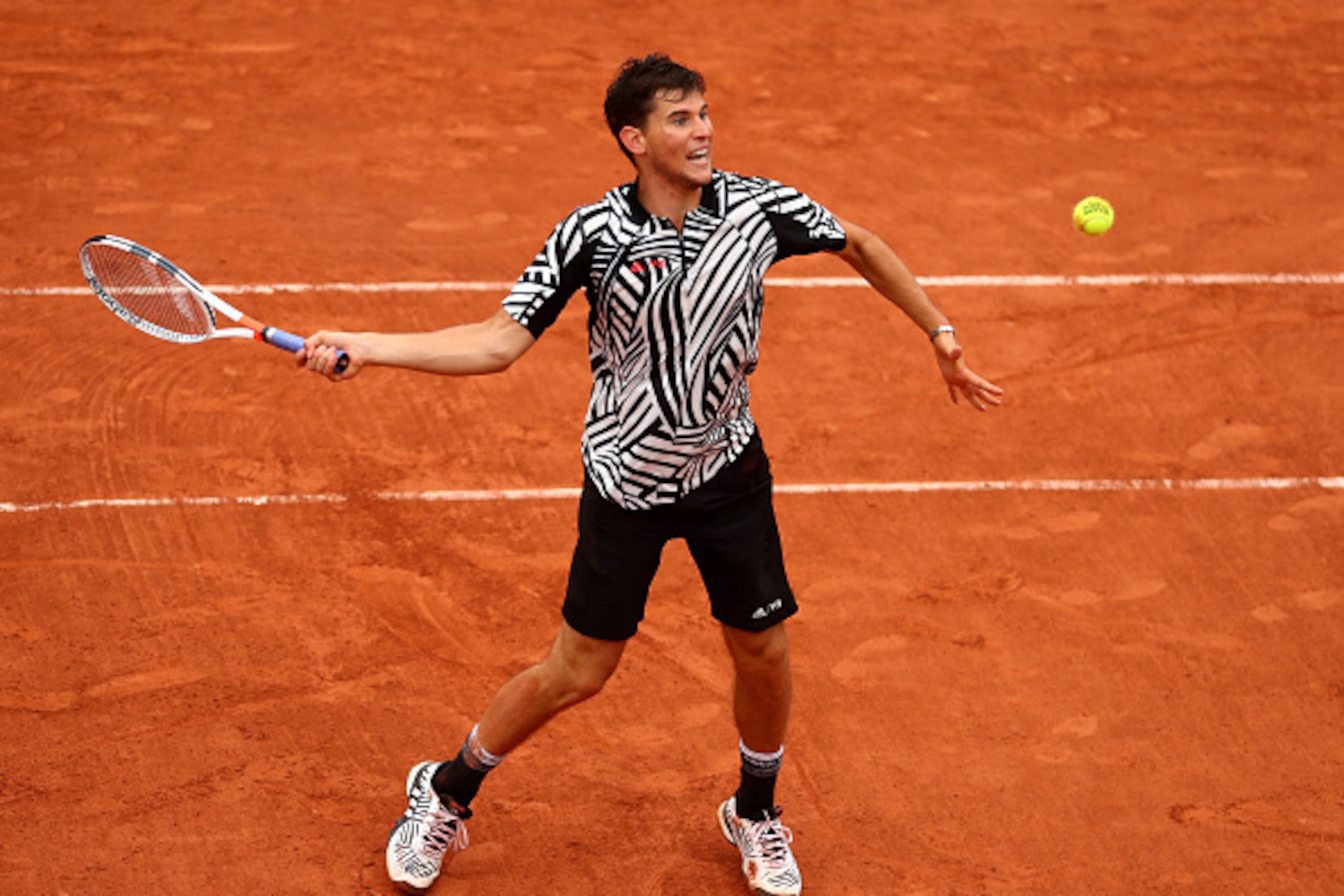 PARIS, FRANCE - MAY 31:  Dominic Thiem of Austria hits a forehand during the Men's Singles fourth round match against Marcel Granollers of France on day ten of the 2016 French Open at Roland Garros on May 31, 2016 in Paris, France.  (Photo by Julian Finne
