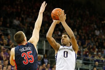 Feb 6, 2016; Seattle, WA, USA; Washington Huskies forward Marquese Chriss (0) shoots over Arizona Wildcats center Kaleb Tarczewski (35) during the second half at Alaska Airlines Arena. Arizona won 77-72. Mandatory Credit: Jennifer Buchanan-USA TODAY Sport