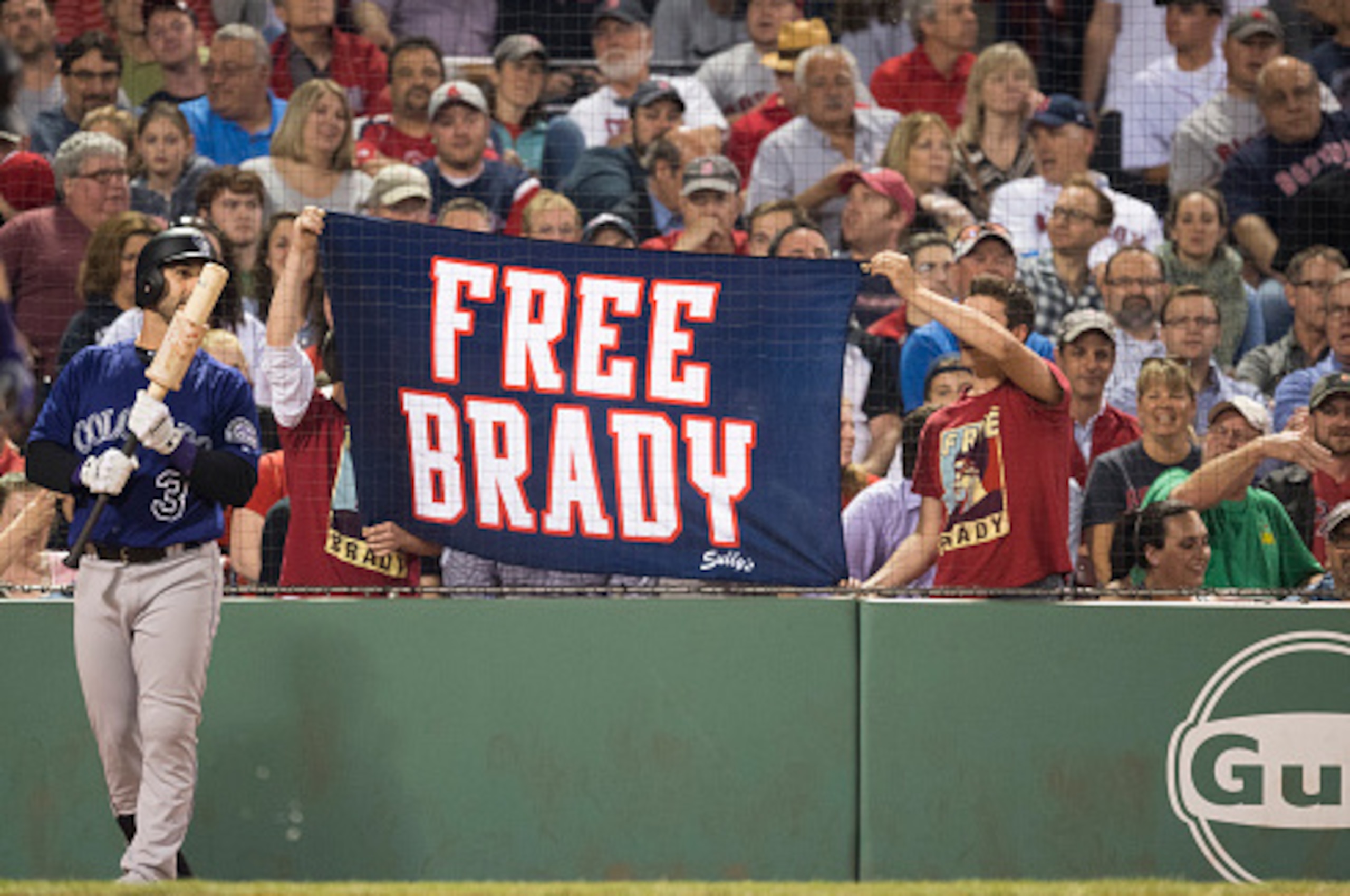 BOSTON, MA - MAY 26: Fans hold a sign in support of New England Patriots quarterback Tom Brady during a game between the Boston Red Sox and the Colorado Rockies in the eighth inning on May 26, 2016  at Fenway Park in Boston, Massachusetts. (Photo by Micha