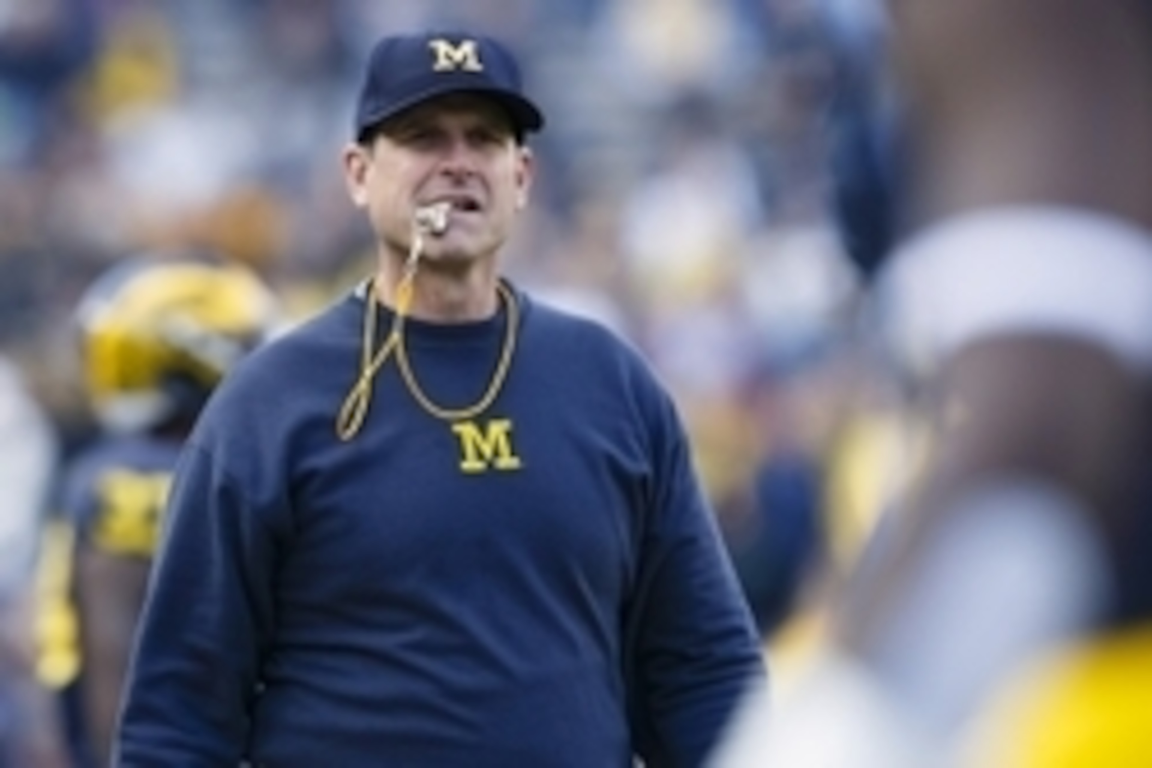 Apr 1, 2016; Ann Arbor, MI, USA; Michigan Wolverines head coach Jim Harbaugh looks on during the spring game at Michigan Stadium. Mandatory Credit: Rick Osentoski-USA TODAY Sports Apr 1, 2016; Ann Arbor, MI, USA; Michigan Wolverines head coach Jim Harbaugh looks on during the spring game at Michigan Stadium. Mandatory Credit: Rick Osentoski-USA TODAY Sports