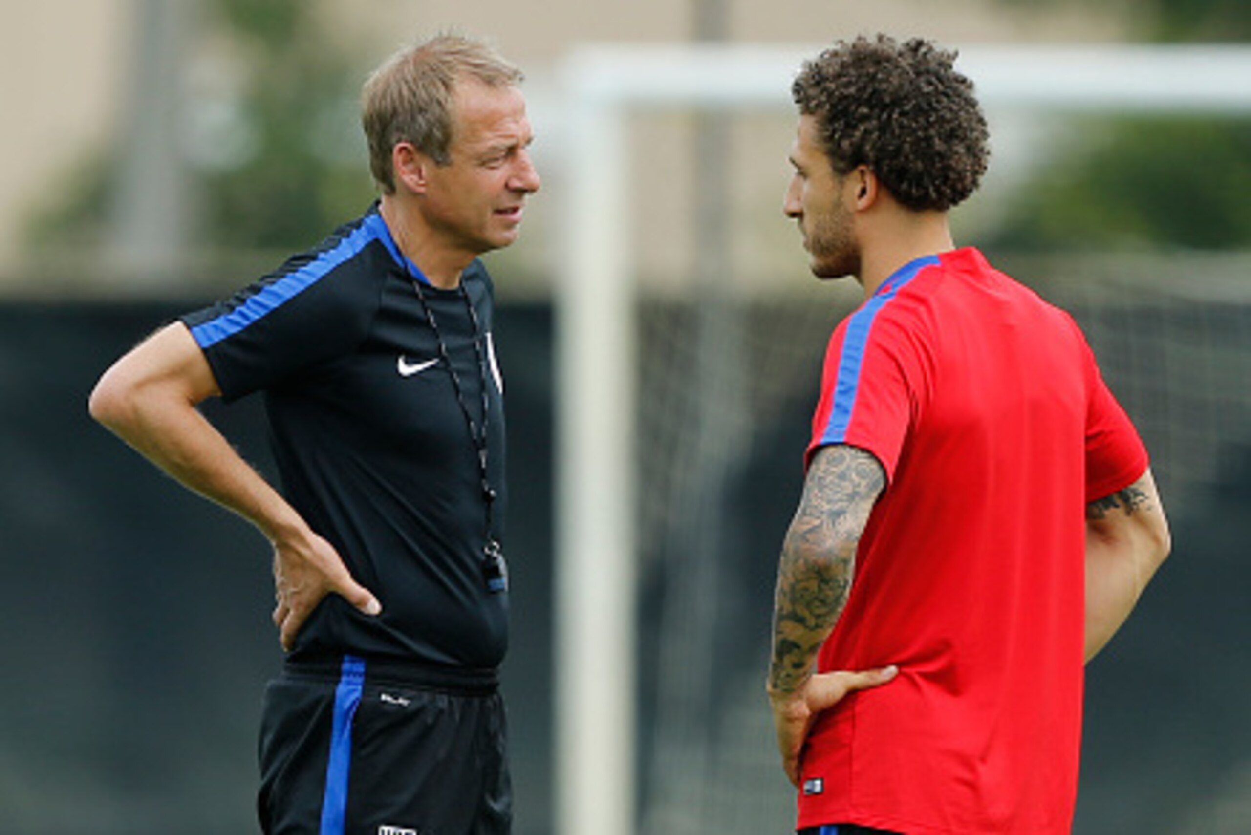 MIAMI SHORES, FL - MAY 18: Head coach Jurgen Klinsmann talks to Fabian Johnson of the U.S. Men's National team during a training session on May 18, 2016 at Buccaneer Field on the campus of Barry University in Miami Shores, Florida. (Photo by Joel Auerbach