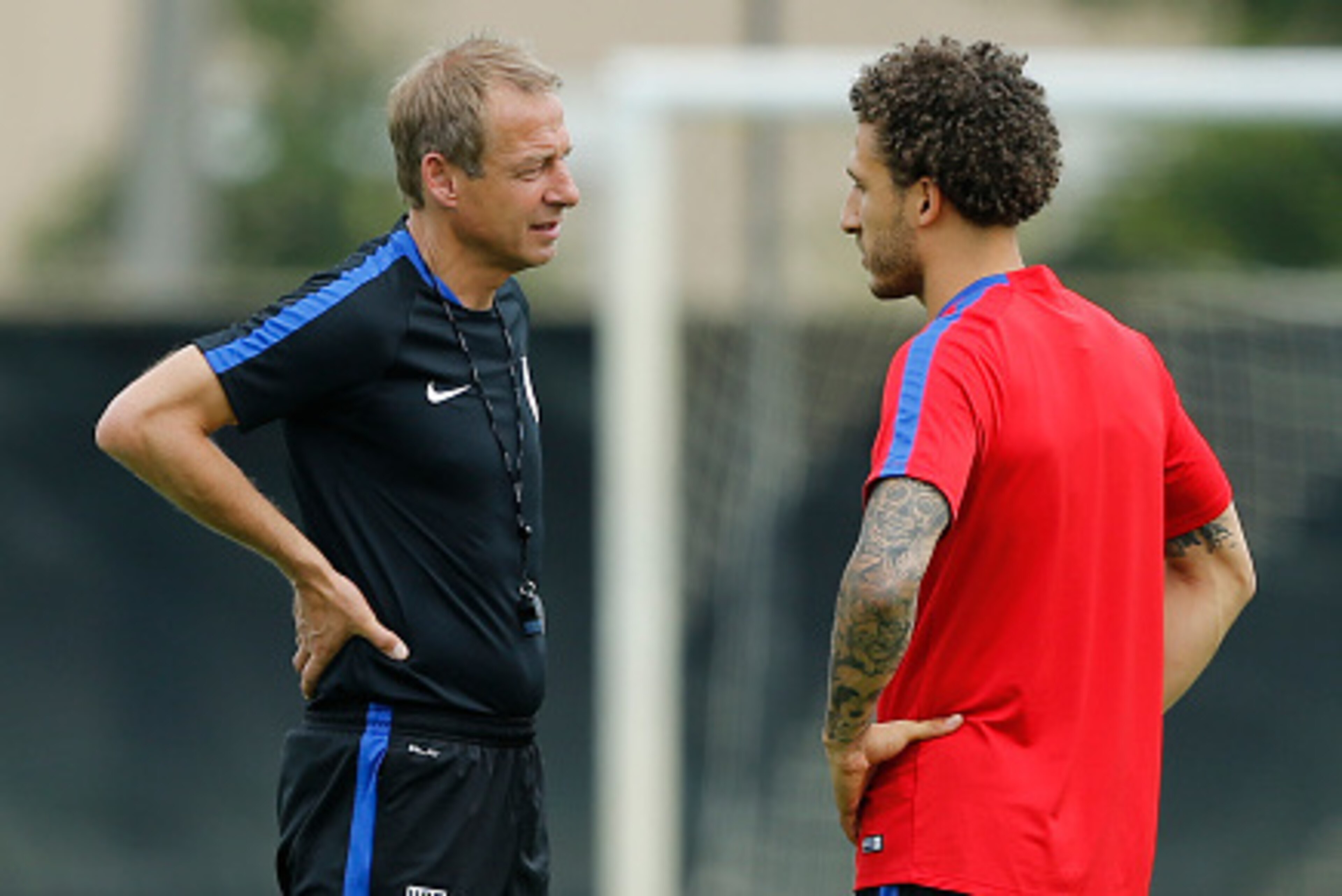 MIAMI SHORES, FL - MAY 18: Head coach Jurgen Klinsmann talks to Fabian Johnson of the U.S. Men's National team during a training session on May 18, 2016 at Buccaneer Field on the campus of Barry University in Miami Shores, Florida. (Photo by Joel Auerbach