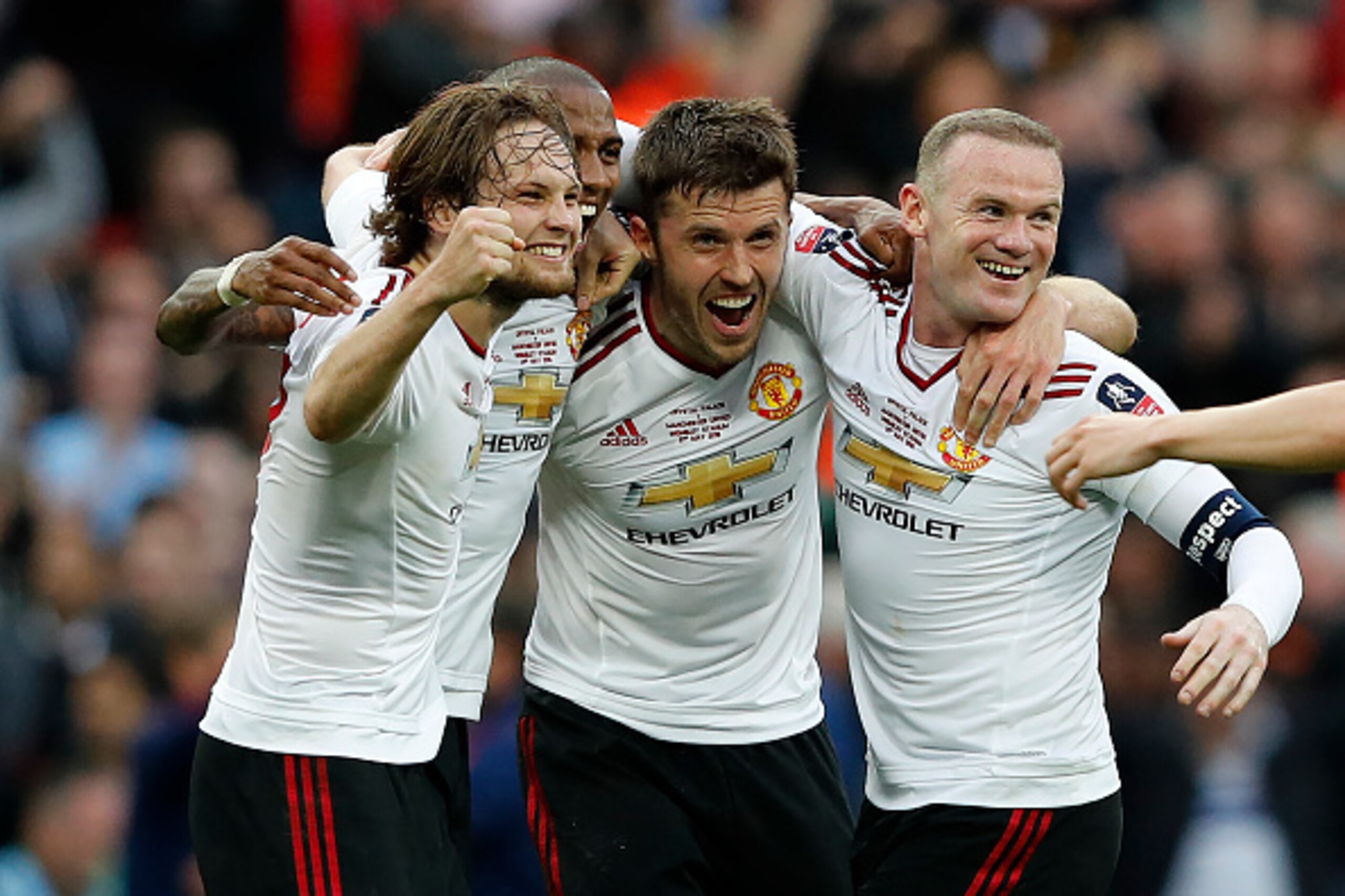 Manchester United's Dutch midfielder Daley Blind (L), Manchester United's English midfielder Ashley Young (2nd L), Manchester United's English midfielder Michael Carrick (2nd R) and Manchester United's English striker Wayne Rooney celebrate on the final w Manchester United's Dutch midfielder Daley Blind (L), Manchester United's English midfielder Ashley Young (2nd L), Manchester United's English midfielder Michael Carrick (2nd R) and Manchester United's English striker Wayne Rooney celebrate on the final w