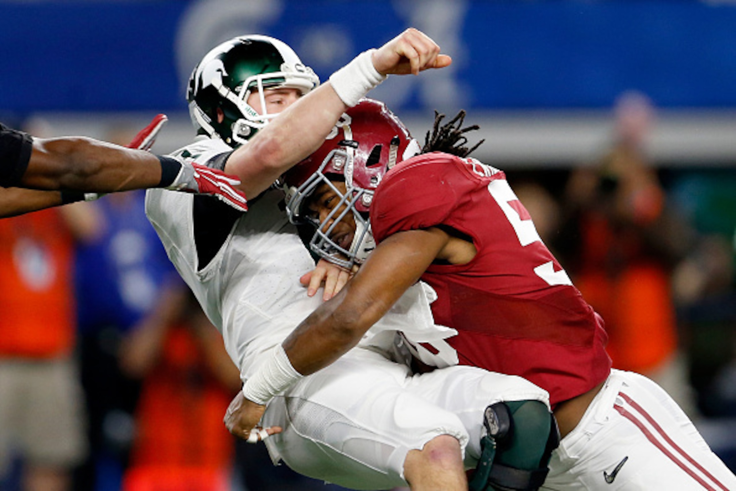 ARLINGTON, TX - DECEMBER 31:  Tim Williams #56 of the Alabama Crimson Tide sacks Connor Cook #18 of the Michigan State Spartans in the second half during the Goodyear Cotton Bowl at AT&T Stadium on December 31, 2015 in Arlington, Texas.  (Photo by Ron Jen