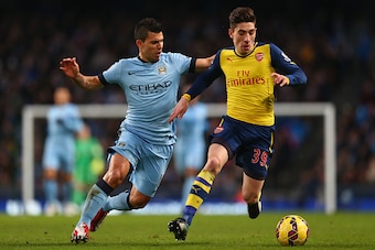 MANCHESTER, ENGLAND - JANUARY 18: Sergio Aguero of Manchester City challenges  Hector Bellerin of Arsenal during the Barclays Premier League match between Manchester City and Arsenal at the Etihad Stadium on January 18, 2015 in Manchester, England.  (Phot