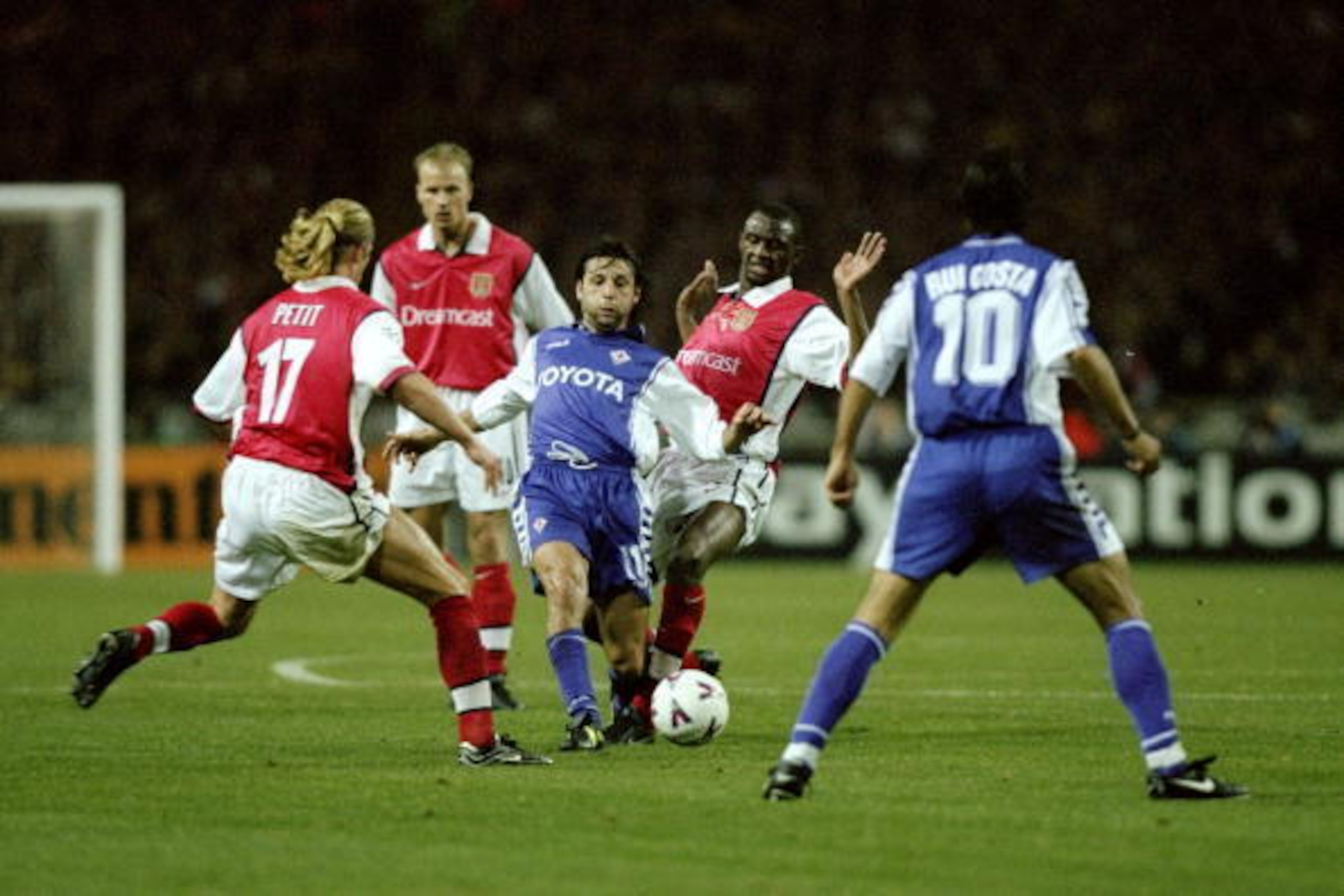 27 Oct 1999:  Fabio Rossitto of Fiorentina takes on Emmanuel Petit (left) and Patrick Vieira of Arsenal during the UEFA European Champions League Group B match played at Wembley Stadium, London. The game finished in a 1-0 away win for Fiorentina and sawth