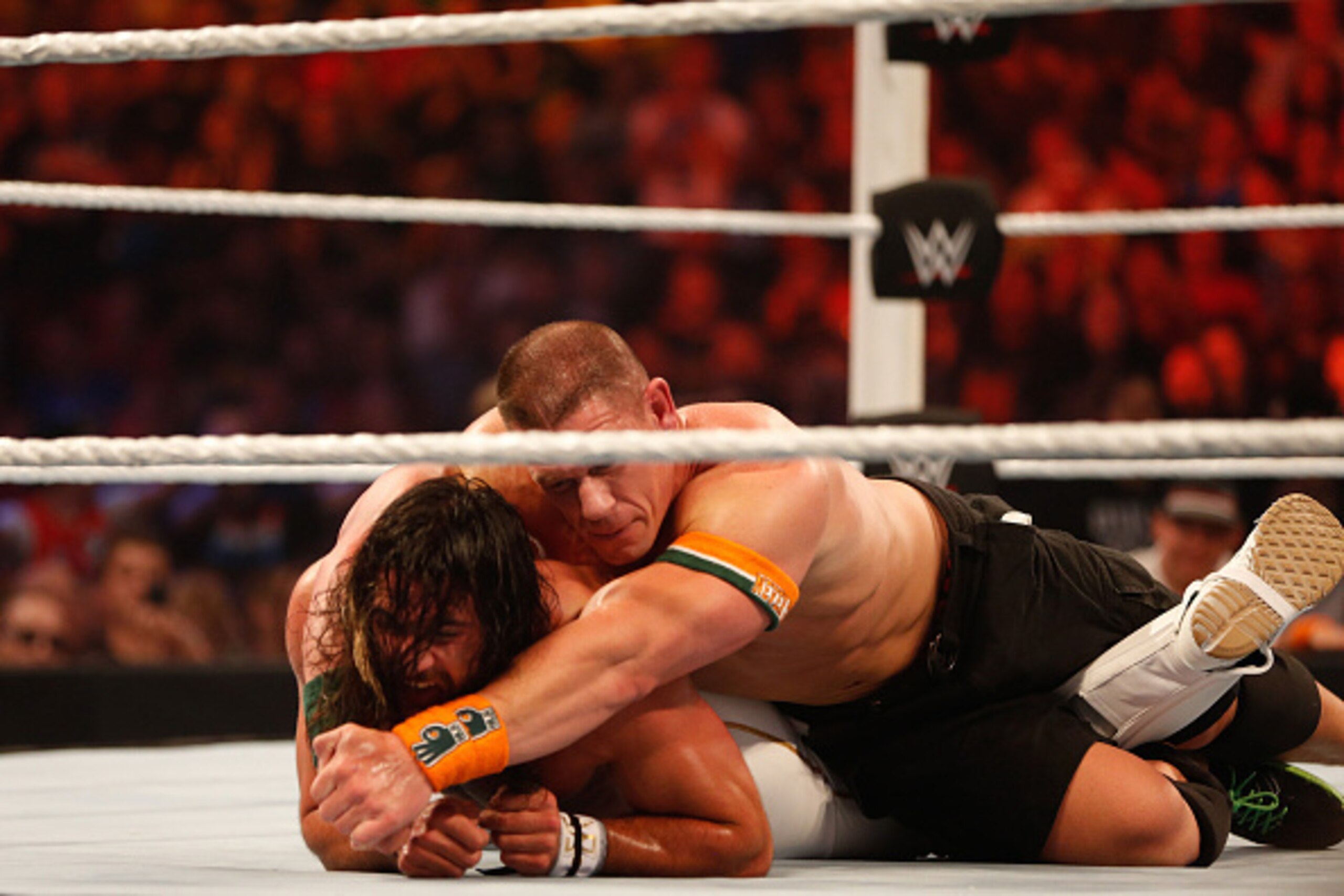 NEW YORK, NY - AUGUST 23:  Seth Rollins and John Cena battle it out at the WWE SummerSlam 2015 at Barclays Center of Brooklyn on August 23, 2015 in New York City.  (Photo by JP Yim/Getty Images)