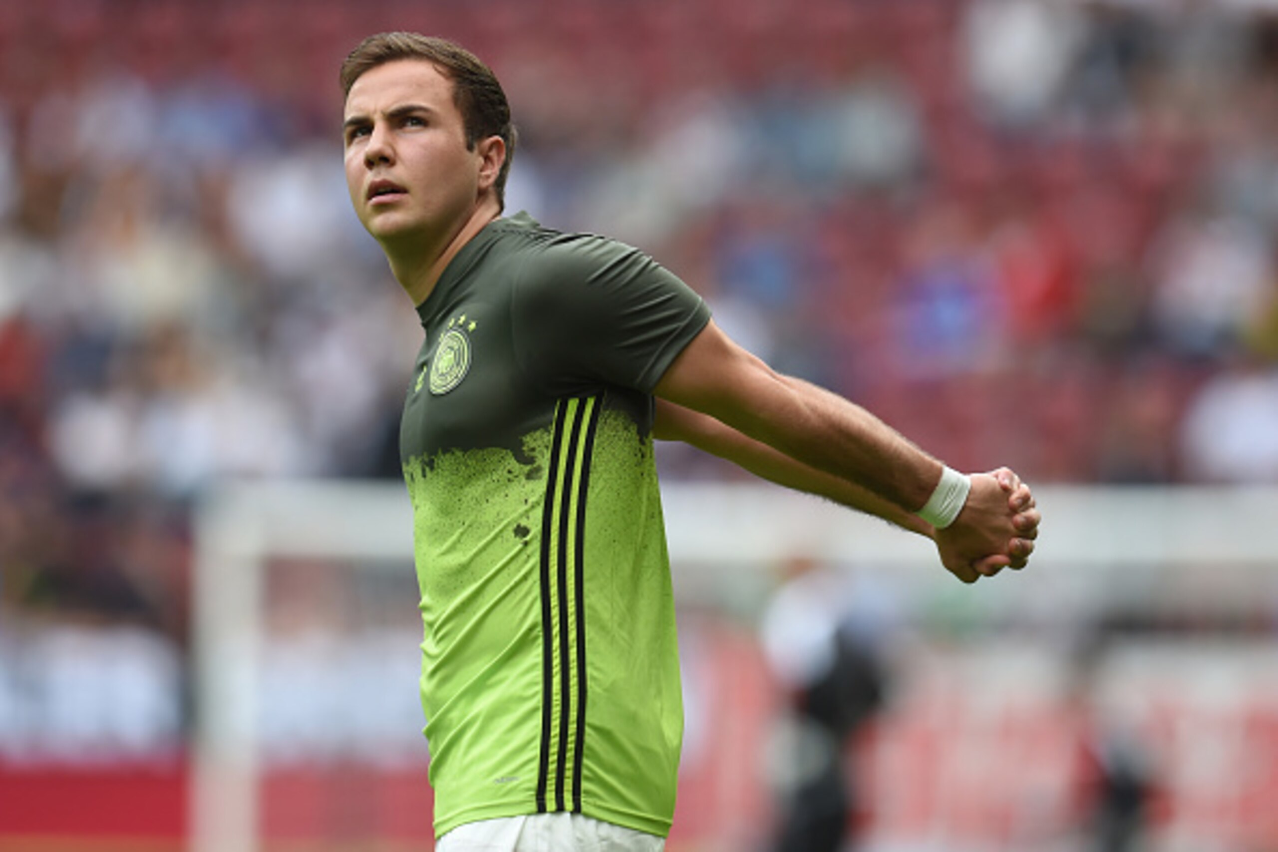 Germany's striker Mario Goetze warms up prior to the friendly football match between Germany and Slovakia in Augsburg, southern Germany, on May 29, 2016.  / AFP / CHRISTOF STACHE        (Photo credit should read CHRISTOF STACHE/AFP/Getty Images)