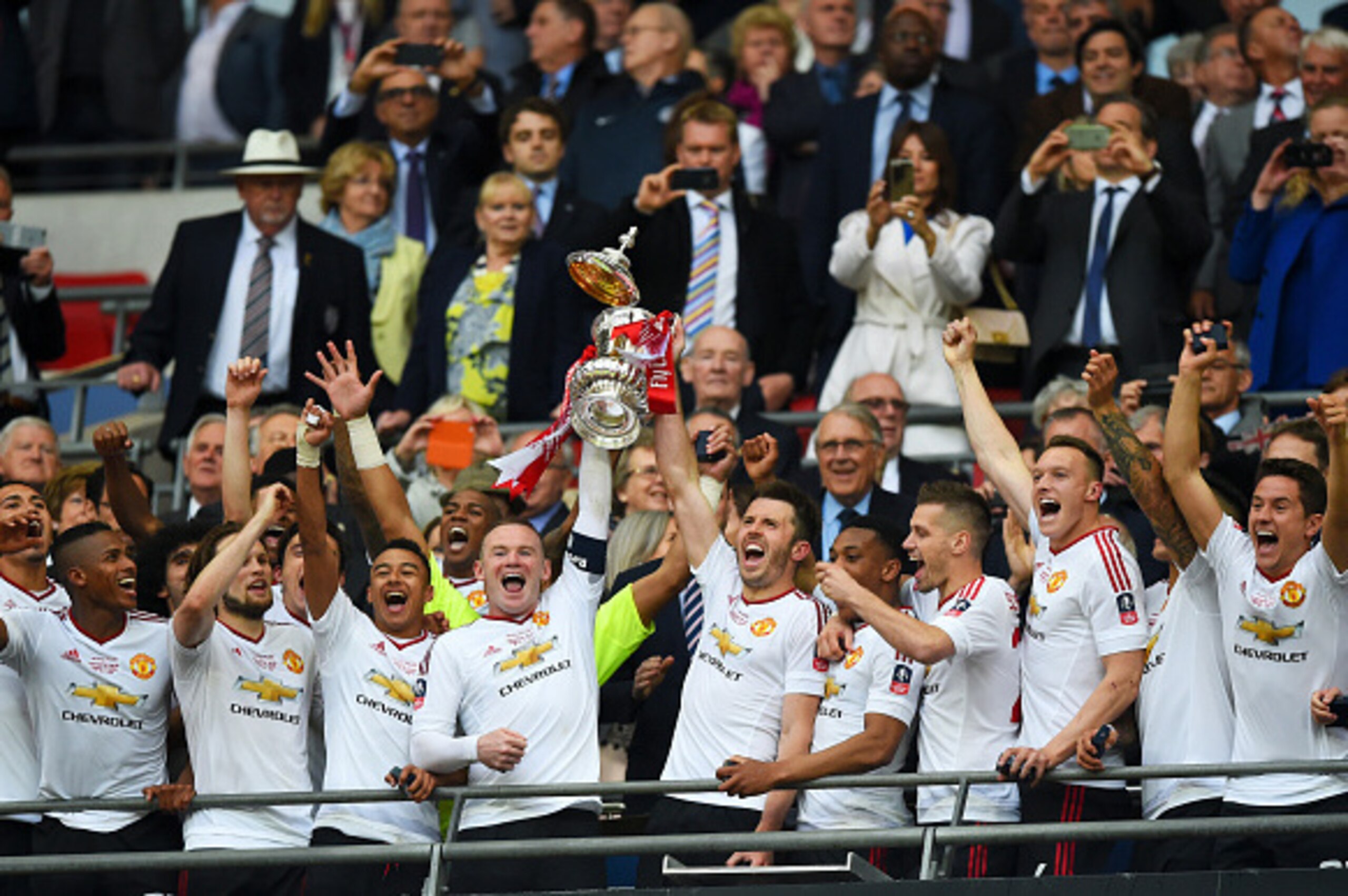 LONDON, ENGLAND - MAY 21:  Wayne Rooney and Michael Carrick of Manchester United lift the trophy after winning The Emirates FA Cup Final match between Manchester United and Crystal Palace at Wembley Stadium on May 21, 2016 in London, England.  (Photo by S