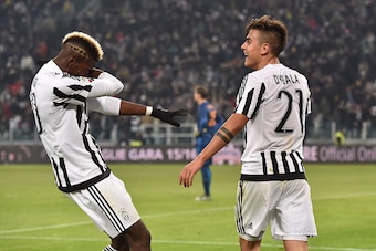 TURIN, ITALY - JANUARY 24:  Paulo Dybala (R) of Juventus FC celebrates after scoring the opening goal with team mate Paul Pogba during the Serie A match between Juventus FC and AS Roma at Juventus Arena on January 24, 2016 in Turin, Italy.  (Photo by Vale