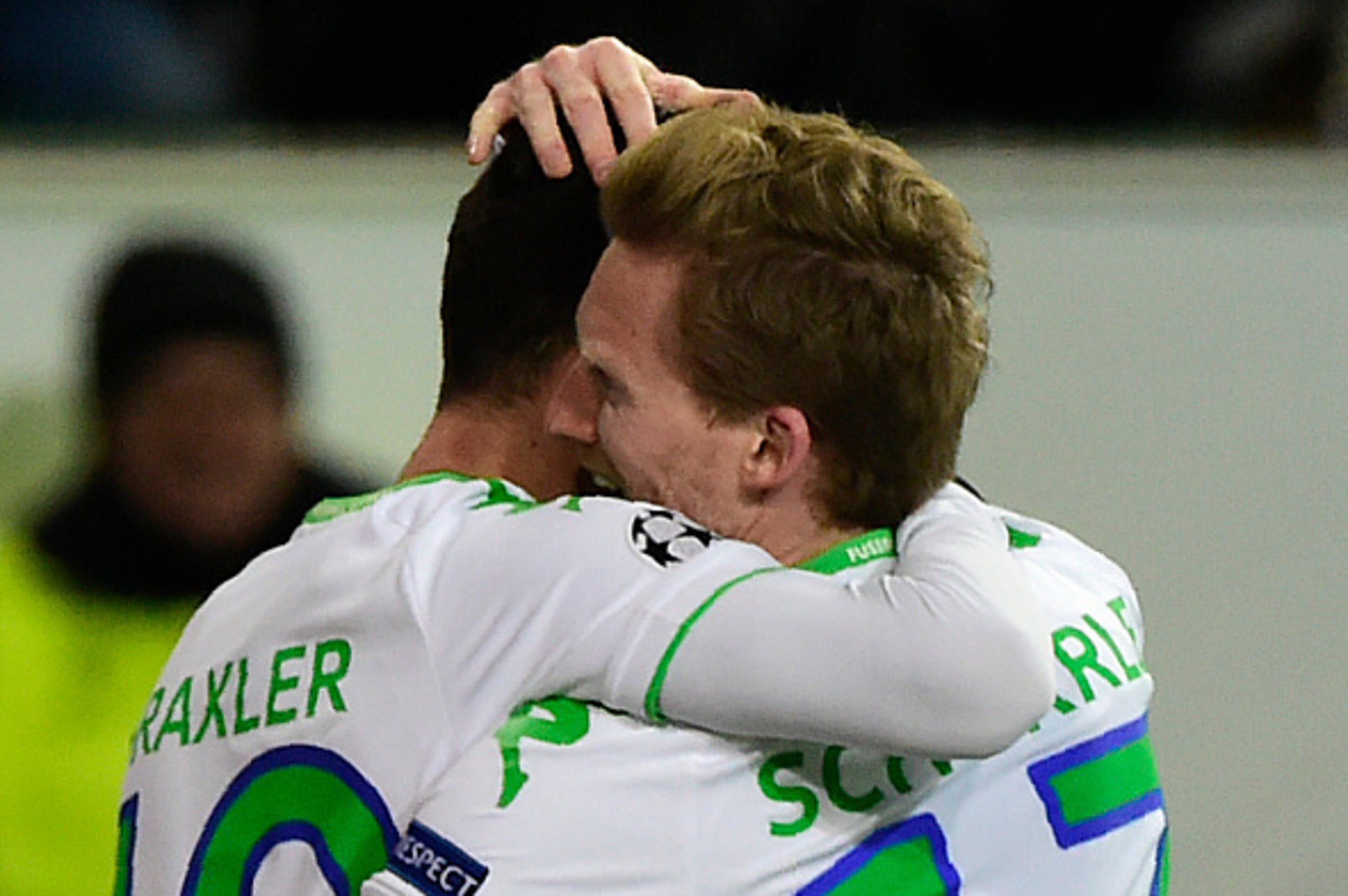 Wolfsburg's striker Andre Schuerrle (R) and Wolfsburg's midfielder Julian Draxler react after scoring during the second-leg round of 16 UEFA Champions league football match between VfL Wolfsburg and KAA Gent at the Volkswagen arena in Wolfsburg on March 8 Wolfsburg's striker Andre Schuerrle (R) and Wolfsburg's midfielder Julian Draxler react after scoring during the second-leg round of 16 UEFA Champions league football match between VfL Wolfsburg and KAA Gent at the Volkswagen arena in Wolfsburg on March 8