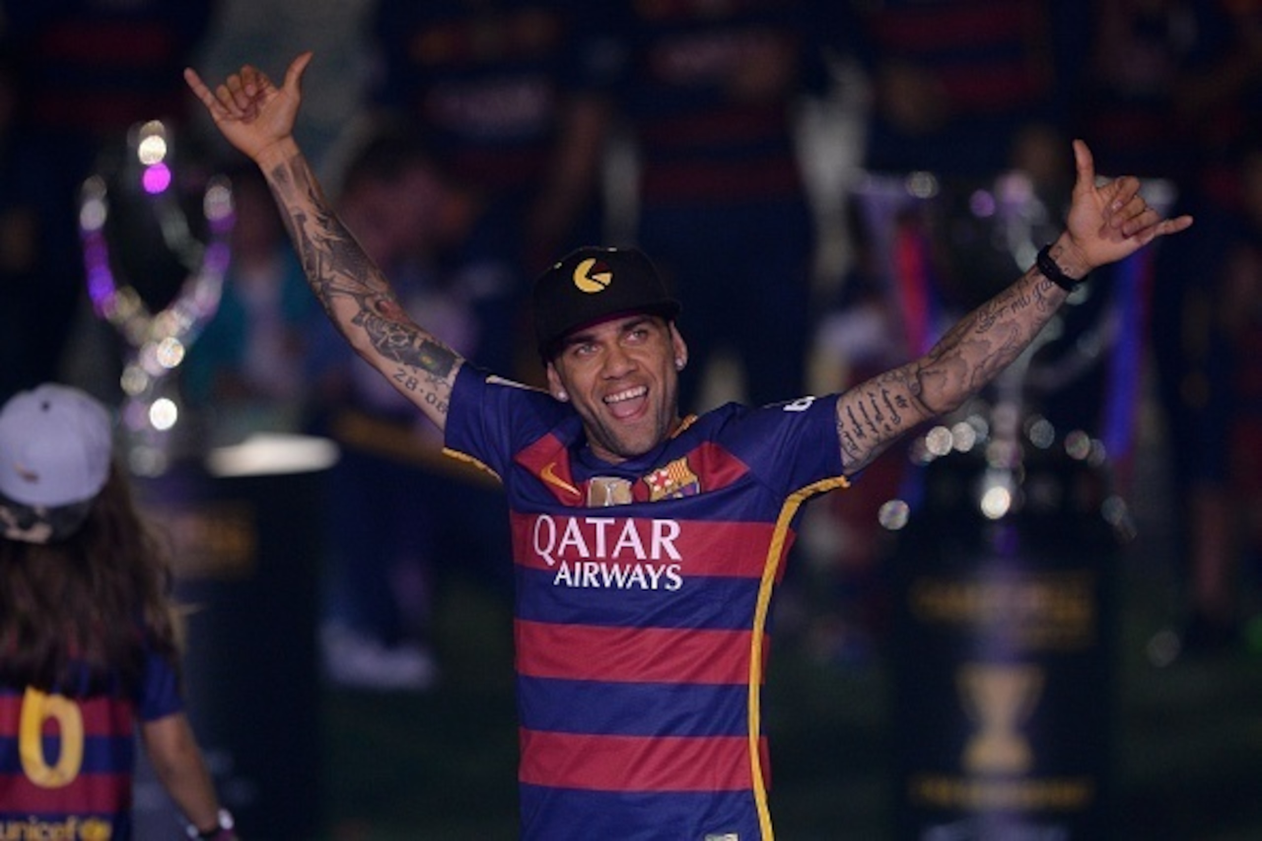 Barcelona's Brazilian defender Dani Alves acknowledges the crowd during celebrations at the Camp Nou stadium in Barcelona on May 23, 2016 following their Spanish 'Copa del Rey' (King's Cup) final football match 2-0 victory over Sevilla FC yesterday also m Barcelona's Brazilian defender Dani Alves acknowledges the crowd during celebrations at the Camp Nou stadium in Barcelona on May 23, 2016 following their Spanish 'Copa del Rey' (King's Cup) final football match 2-0 victory over Sevilla FC yesterday also m