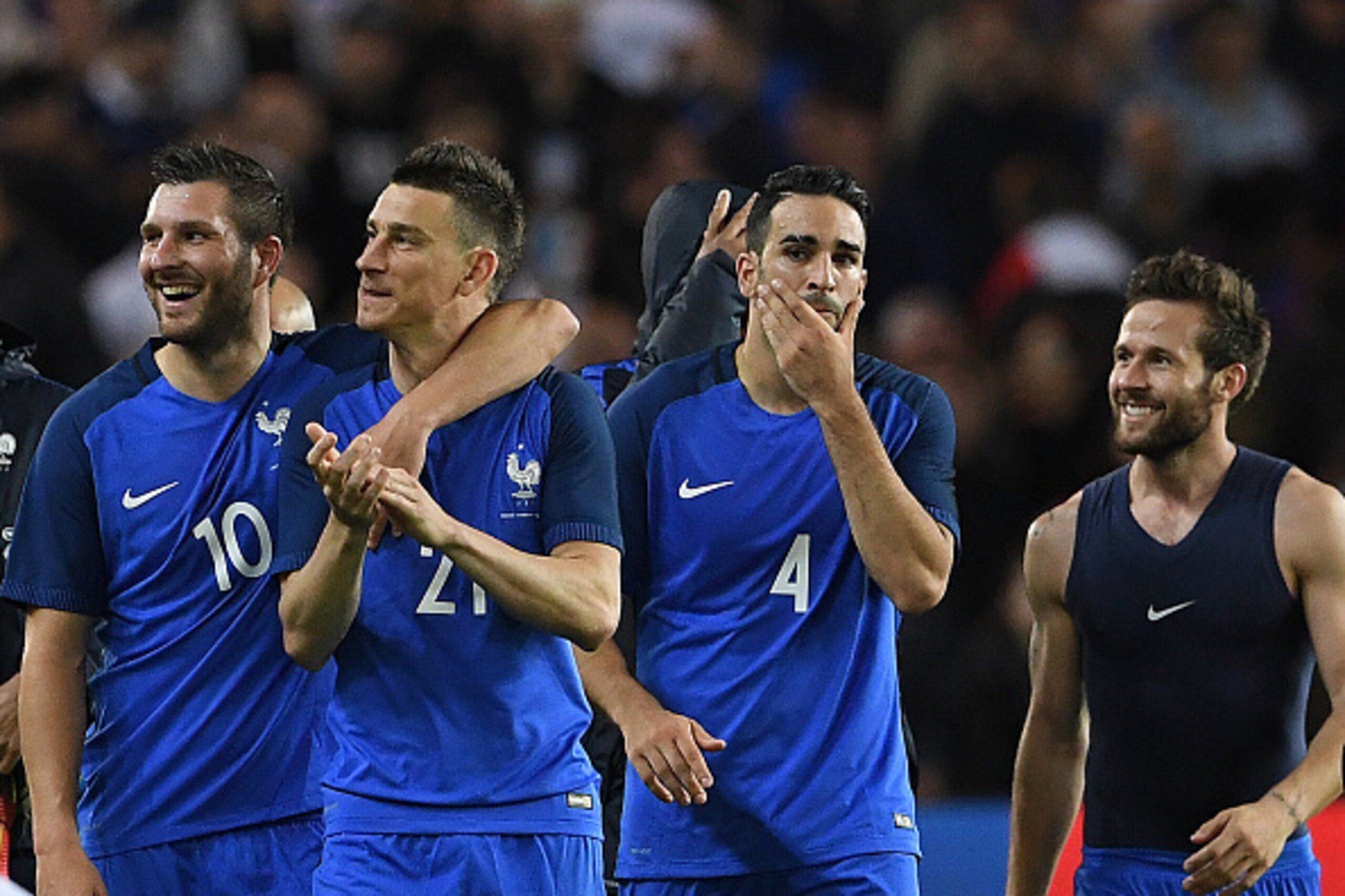 (From L) France's forward Andre Pierre Gignac, defender Laurent Koscielny, defender Adil Rami and midfielder Yohan Cabaye  react after winning the friendly football match between France and Cameroon, at the Beaujoire Stadium in Nantes, western France, on