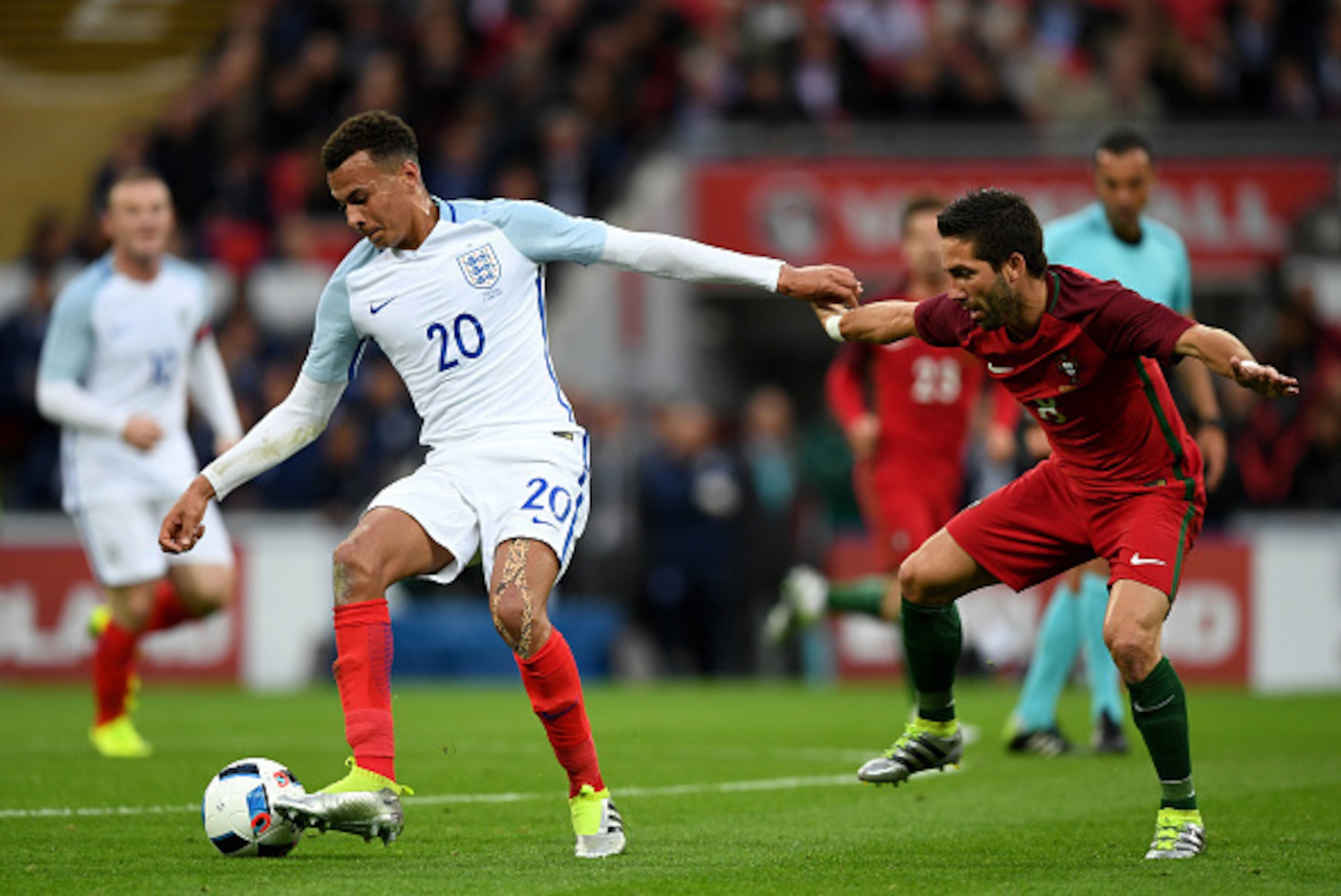LONDON, ENGLAND - JUNE 02:  Dele Alli of England holds off Joao Moutinho of Portugal during the international friendly match between England and Portugal at Wembley Stadium on June 2, 2016 in London, England.  (Photo by Shaun Botterill/Getty Images)