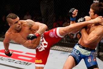 JARAGUA DO SUL, BRAZIL - MAY 18: (L-R) Vitor Belfort knocks out Luke Rockhold with a spinning heel kick in their middleweight bout during the UFC on FX event on May 18, 2013 at Arena Jaragua in Jaragua do Sul, Santa Catarina, Brazil. (Photo by Josh Hedges