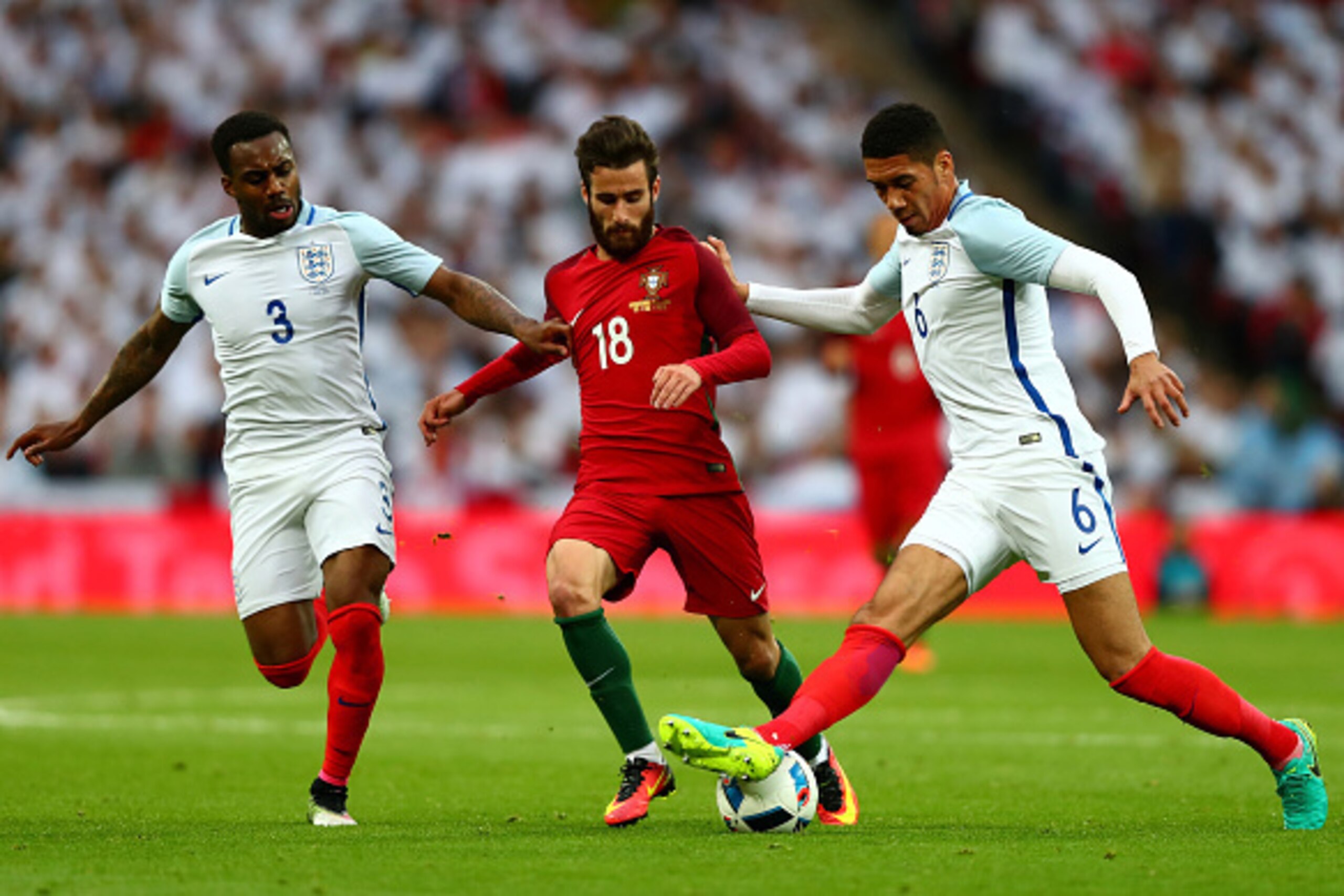 LONDON, ENGLAND - JUNE 02:  Rafa Silva of Portugal takes on Danny Rose (L) and Chris Smalling of England during the international friendly match between England and Portugal at Wembley Stadium on June 2, 2016 in London, England.  (Photo by Clive Rose/Gett