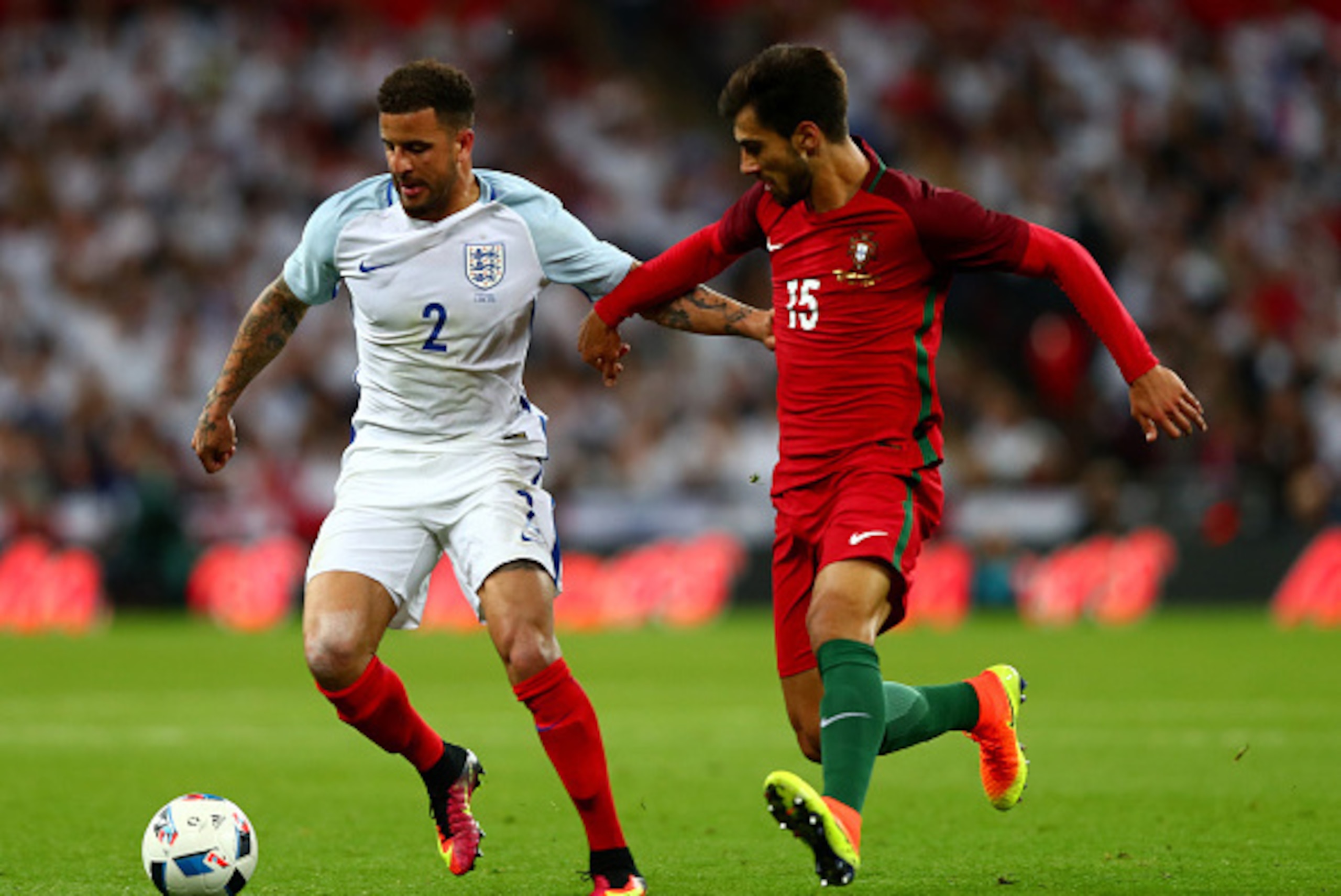 LONDON, ENGLAND - JUNE 02:  Kyle Walker of England holds off Andre Gomes of Portugal during the international friendly match between England and Portugal at Wembley Stadium on June 2, 2016 in London, England.  (Photo by Clive Rose/Getty Images)