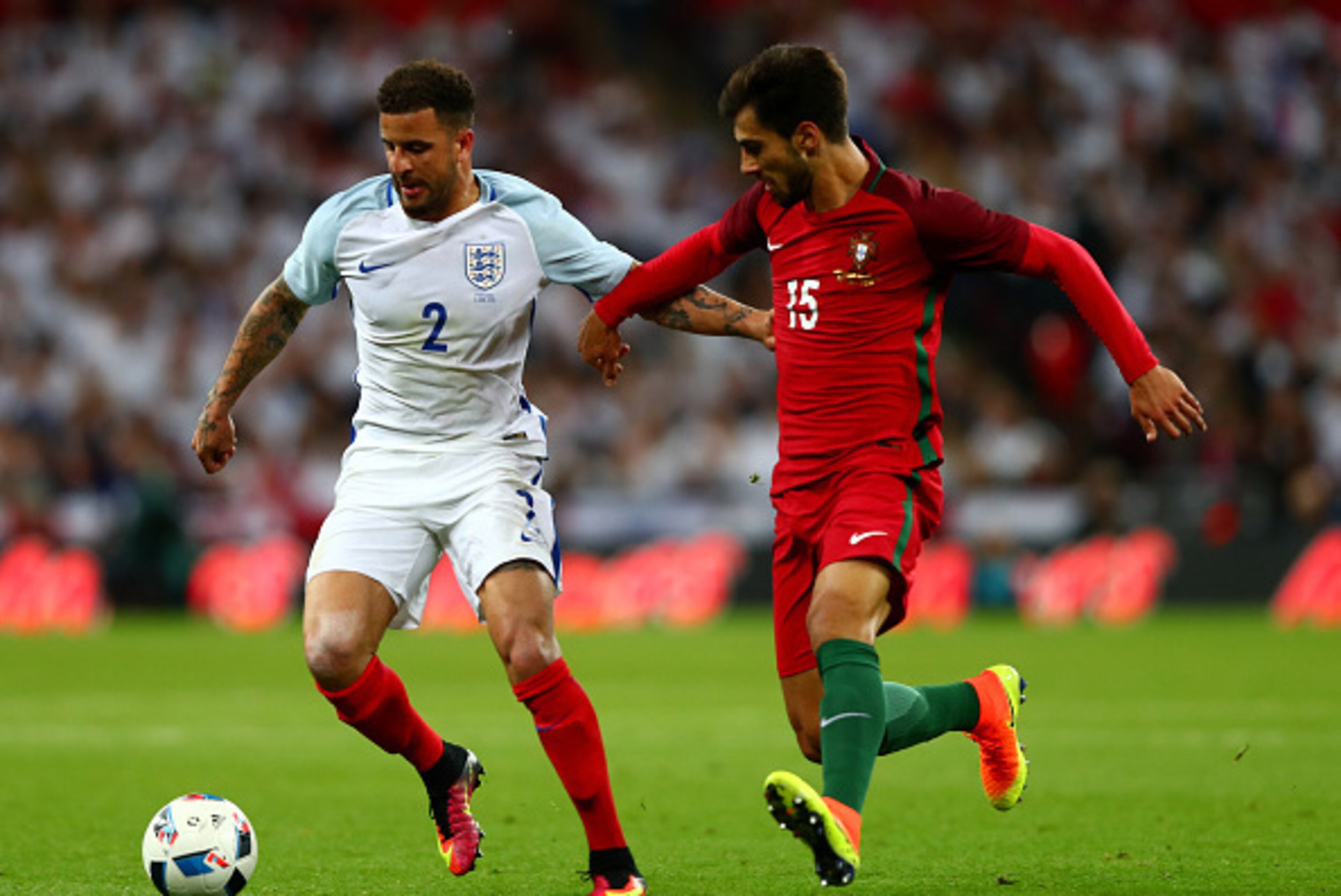 LONDON, ENGLAND - JUNE 02:  Kyle Walker of England holds off Andre Gomes of Portugal during the international friendly match between England and Portugal at Wembley Stadium on June 2, 2016 in London, England.  (Photo by Clive Rose/Getty Images)