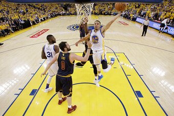 OAKLAND, CA - JUNE 02:  Stephen Curry #30 of the Golden State Warriors shoots over Kevin Love #0 of the Cleveland Cavaliers in Game 1 of the 2016 NBA Finals at ORACLE Arena on June 2, 2016 in Oakland, California. NOTE TO USER: User expressly acknowledges 