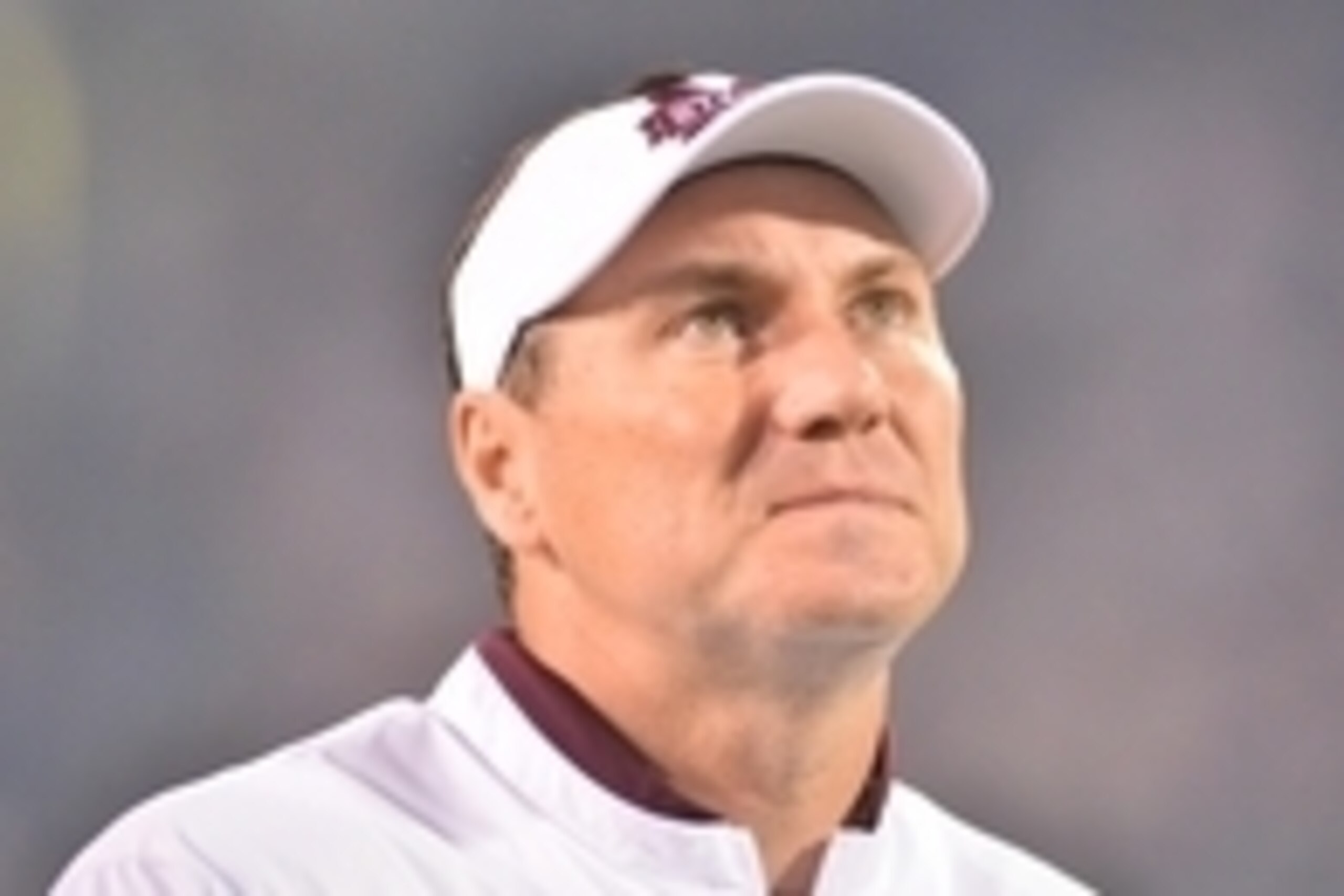 Nov 28, 2015; Starkville, MS, USA; Mississippi State Bulldogs head coach Dan Mullen watches a highlight video during the senior night program before the game against the Mississippi Rebels at Davis Wade Stadium Mississippi won 38-27.. Mandatory Credit: Ma