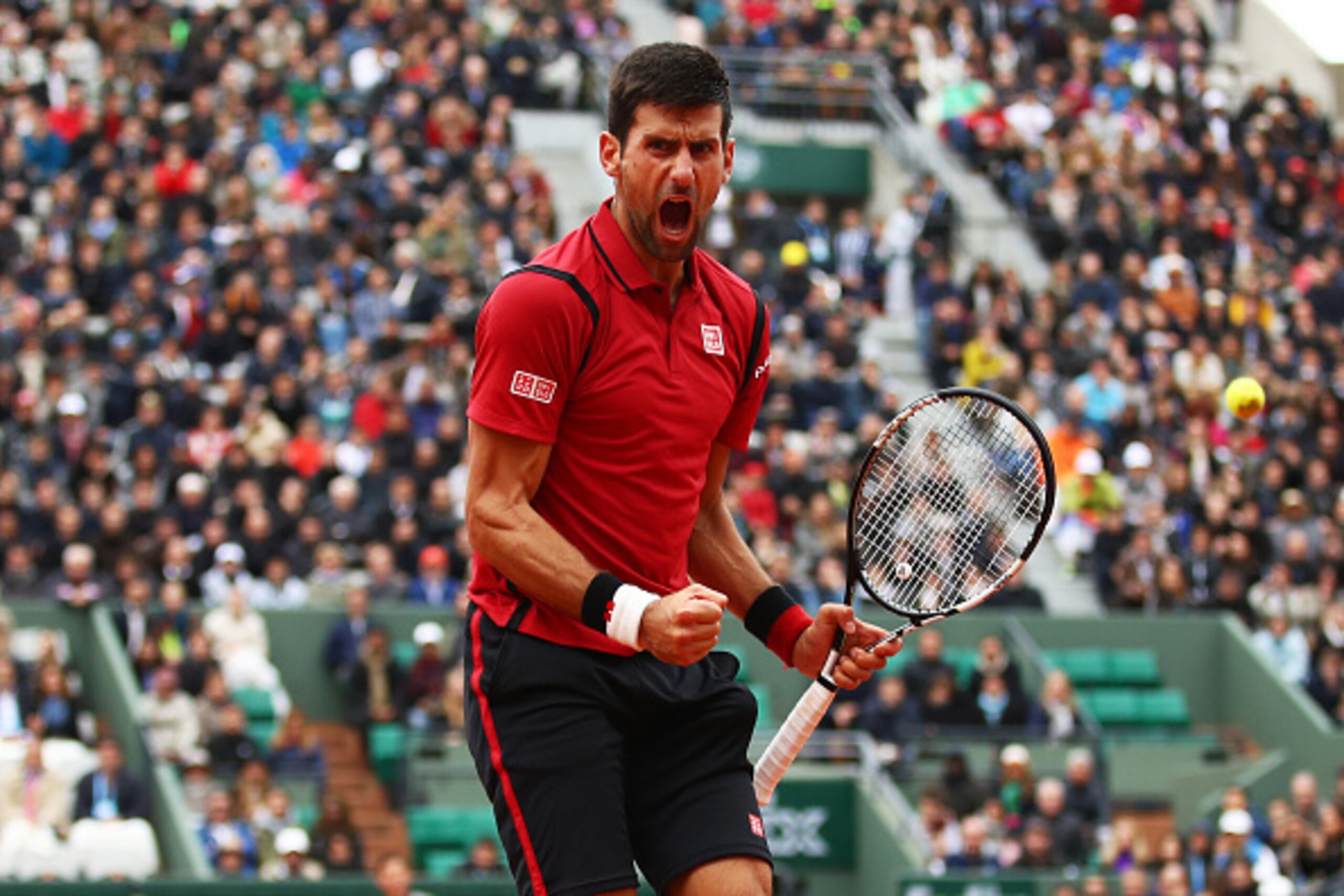 PARIS, FRANCE - JUNE 03:  Novak Djokovic of Serbia reacts during the Men's Singles semi final match against Dominic Thiem of Austria on day thirteen of the 2016 French Open at Roland Garros on June 3, 2016 in Paris, France.  (Photo by Clive Brunskill/Gett