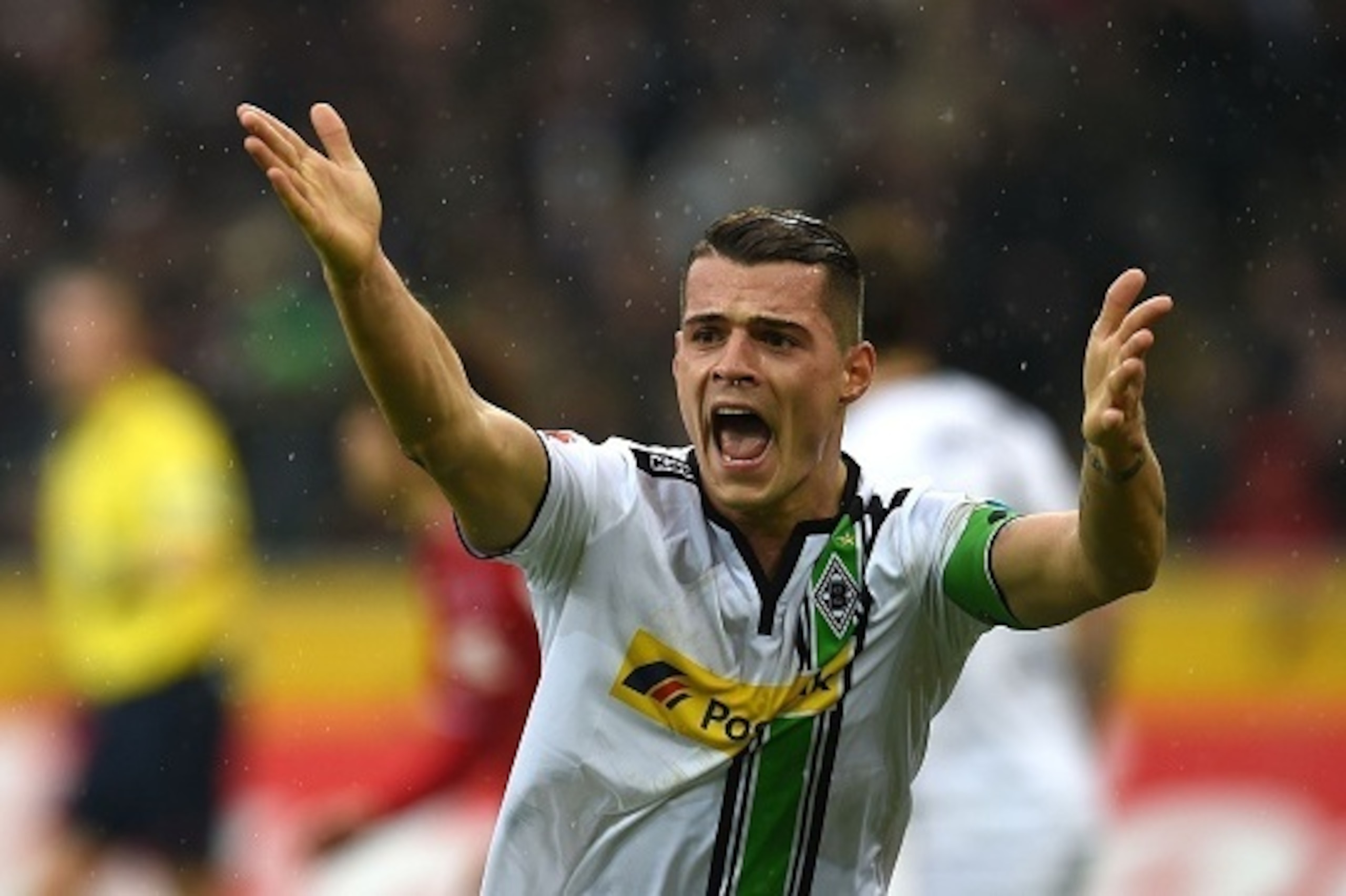 Moenchengladbach's Swiss midfielder Granit Xhaka reacts during the German first division Bundesliga football match Borussia Moenchengladbach vs 1. FC Cologne in Moenchengladbach , western Germany, on February  20, 2016. / AFP / PATRIK STOLLARZ / RESTRICTI
