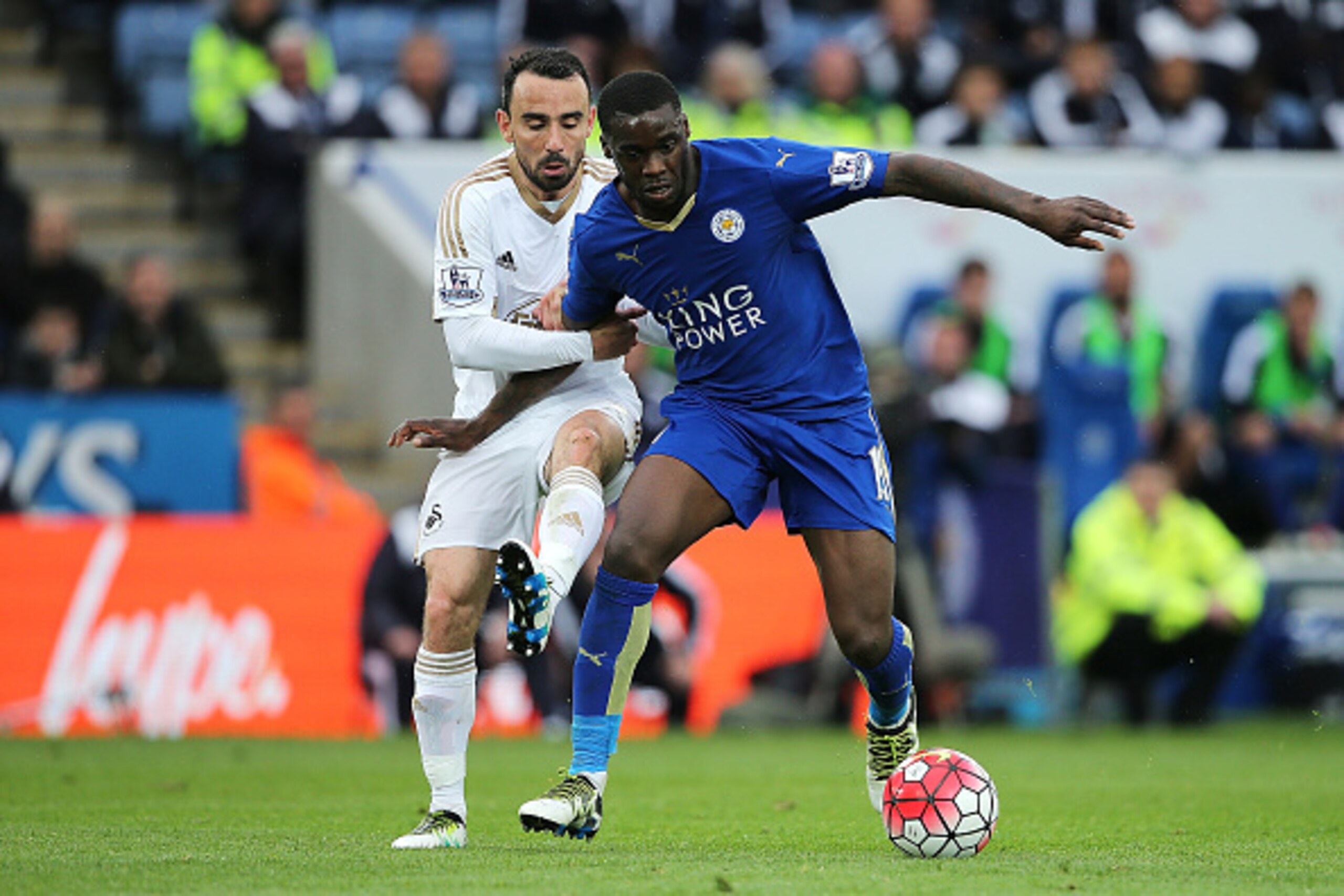 LEICESTER, ENGLAND - APRIL 24:  N'Golo Kante of Leicester City competes with Leon Britton of Swansea City during the Barclays Premier League match between Leicester City and Swansea City at The King Power Stadium on April 24, 2016 in Leicester, United Kin