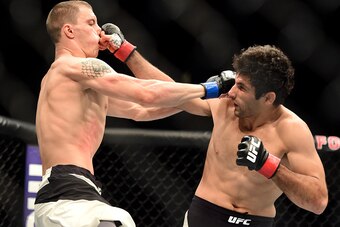 INGLEWOOD, CA - JUNE 04:  James Vick and Beneil Darush of Iran exchange blows in their lightweight bout during the UFC 199 event at The Forum on June 4, 2016 in Inglewood, California.  (Photo by Harry How/Zuffa LLC/Zuffa LLC via Getty Images)