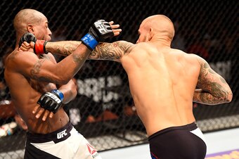 INGLEWOOD, CA - JUNE 04: Dustin Poirier punches Bobby Green in their lightweight bout during the UFC 199 event at The Forum on June 4, 2016 in Inglewood, California.  (Photo by Josh Hedges/Zuffa LLC/Zuffa LLC via Getty Images)