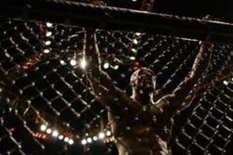 Jun 4, 2016; Los Angeles, CA, USA; Kevin Casey (red) takes a breather while fighting Elvis Mutapcic (not pictured) during UFC 199 at The Forum. Mandatory Credit: Jake Roth-USA TODAY Sports