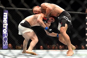 INGLEWOOD, CA - JUNE 04:  Max Holloway wrestles Ricardo Lamas in their featherweight bout during the UFC 199 event at The Forum on June 4, 2016 in Inglewood, California.  (Photo by Harry How/Zuffa LLC/Zuffa LLC via Getty Images)