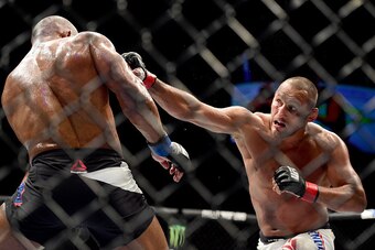 INGLEWOOD, CA - JUNE 04:  Dan Henderson punches Hector Lombard of Cuba in their middleweight bout during the UFC 199 event at The Forum on June 4, 2016 in Inglewood, California.  (Photo by Harry How/Zuffa LLC/Zuffa LLC via Getty Images)