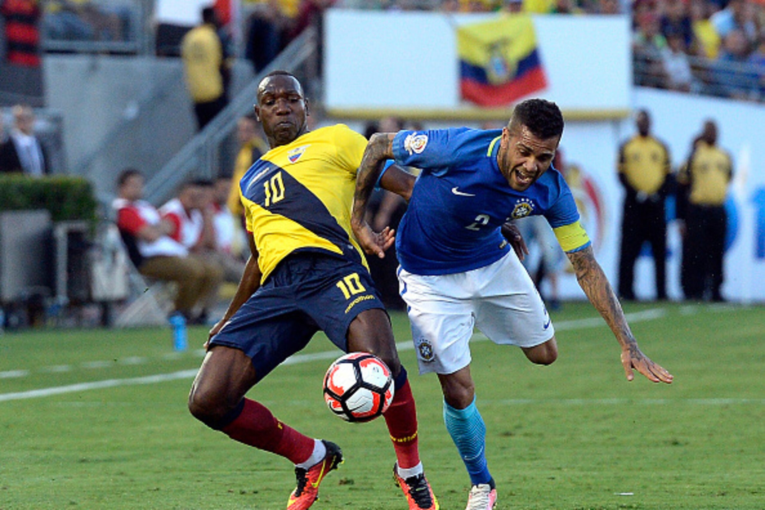 PASADENA CA - JUNE 4: Daniel Alves #2 of Brazil and Walter Ayovi #10 of Ecuador battle for the ball during the first half of the 2016 Copa America Centenario Group B match between Brazil and Ecuador at the Rose Bowl on June 4, 2016 in Pasadena, California