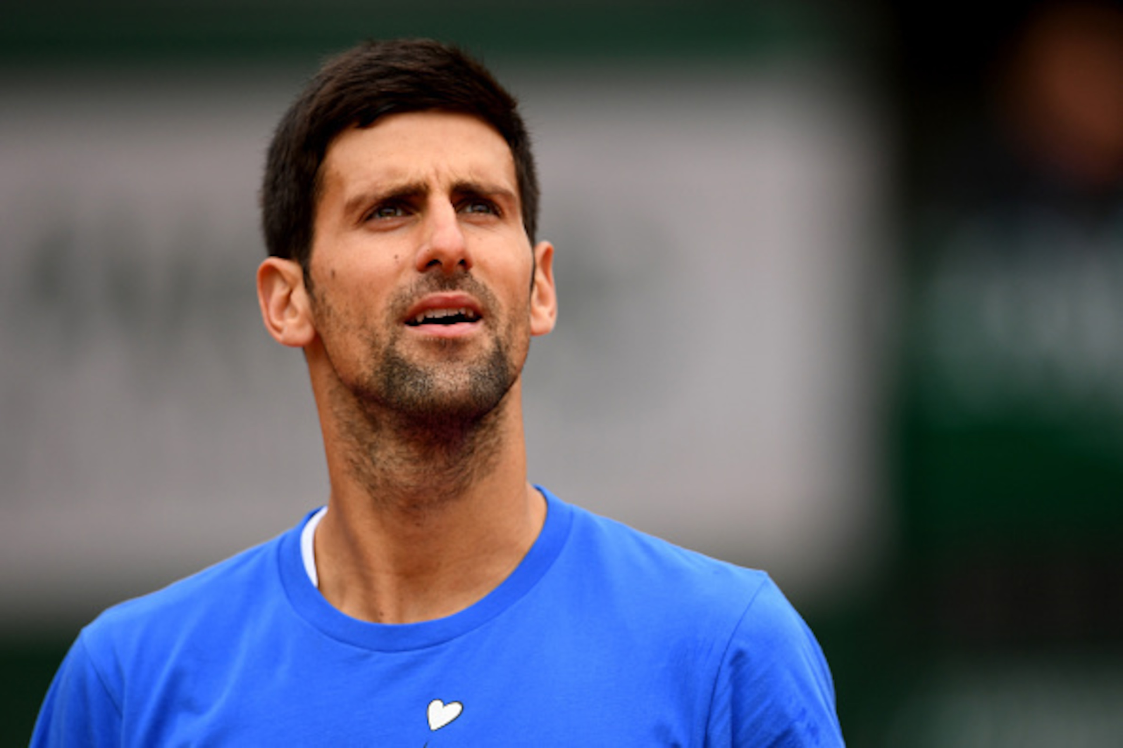 PARIS, FRANCE - JUNE 04:  Novak Djokovic of Serbia looks on during a training session on day fourteen of the 2016 French Open at Roland Garros on June 4, 2016 in Paris, France.  (Photo by Dennis Grombkowski/Getty Images)