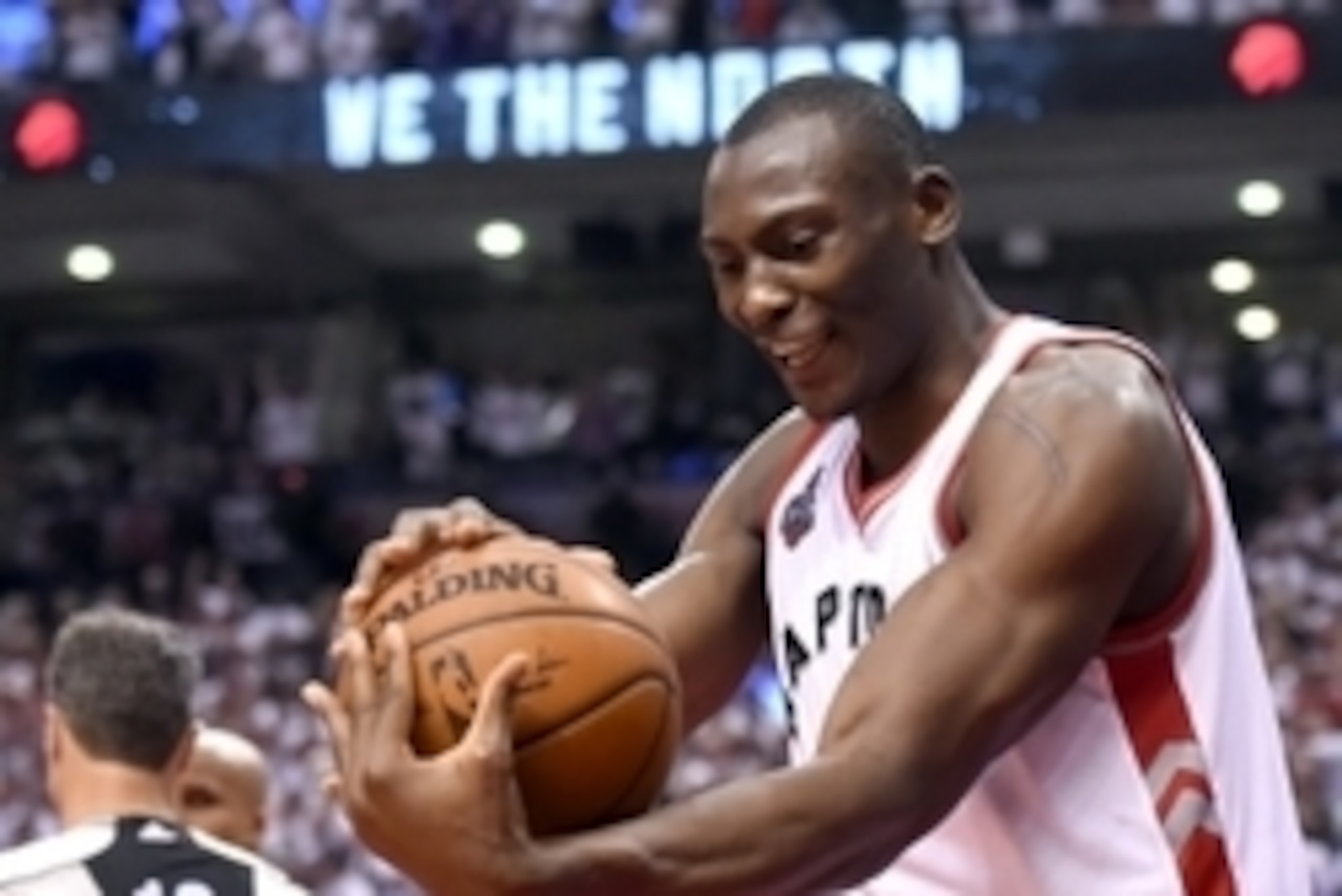 May 23, 2016; Toronto, Ontario, CAN;  Toronto Raptors center Bismack Biyombo (8) smiles as he holds the ball at the end of a 105-99 win over Cleveland Cavaliers in game four of the Eastern conference finals of the NBA Playoffs at Air Canada Centre. Mandat