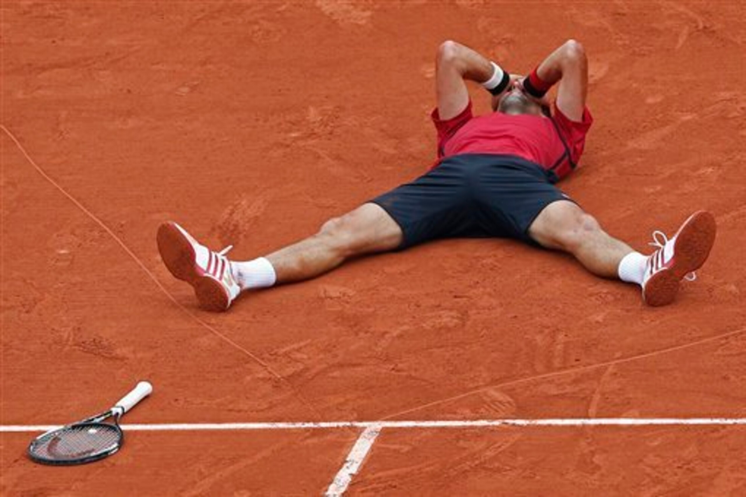 Djokovic reacting to completing the career Grand Slam
