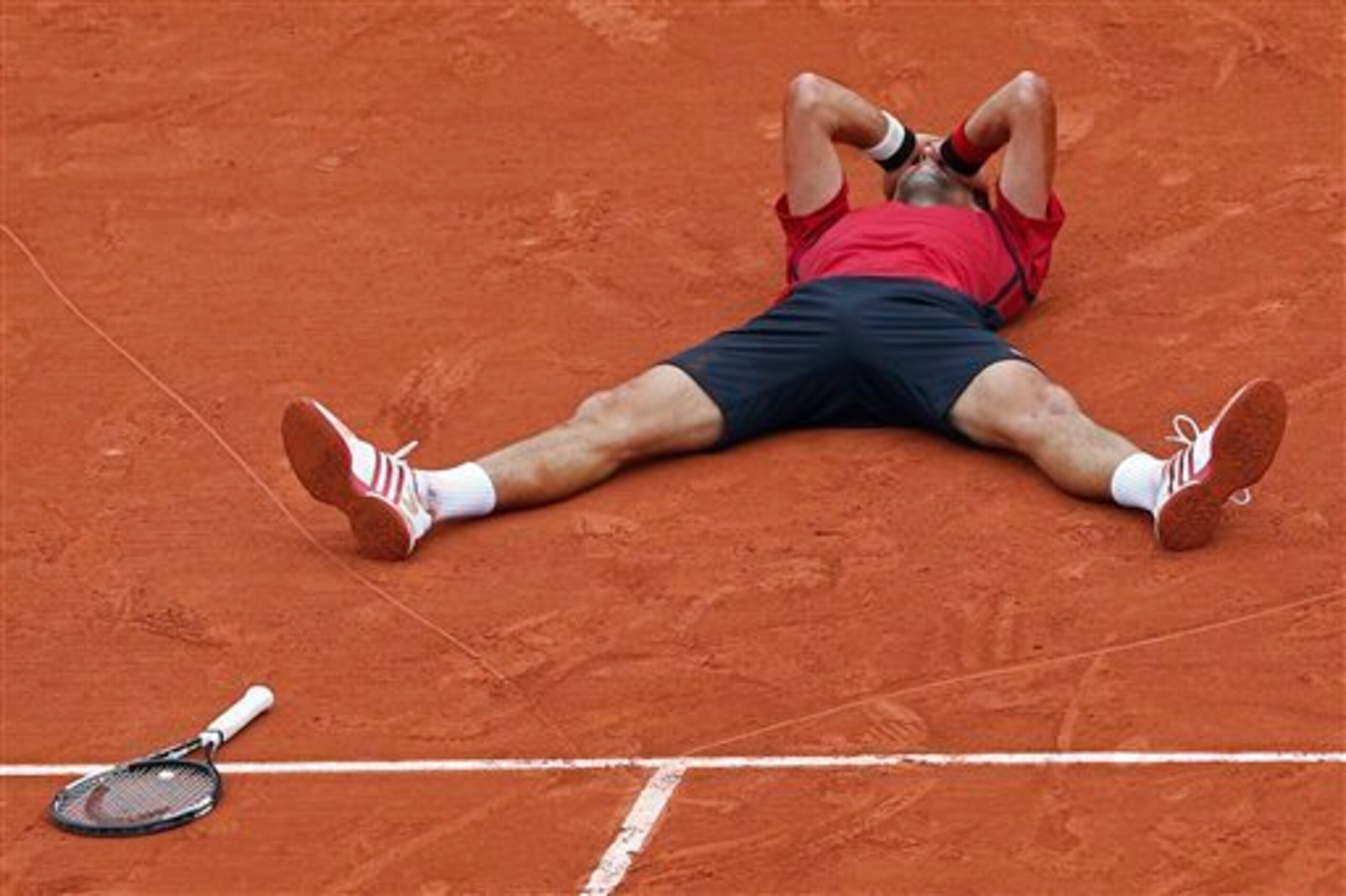 Djokovic crumpled to the floor after completing a non-calendar Grand Slam on Sunday.