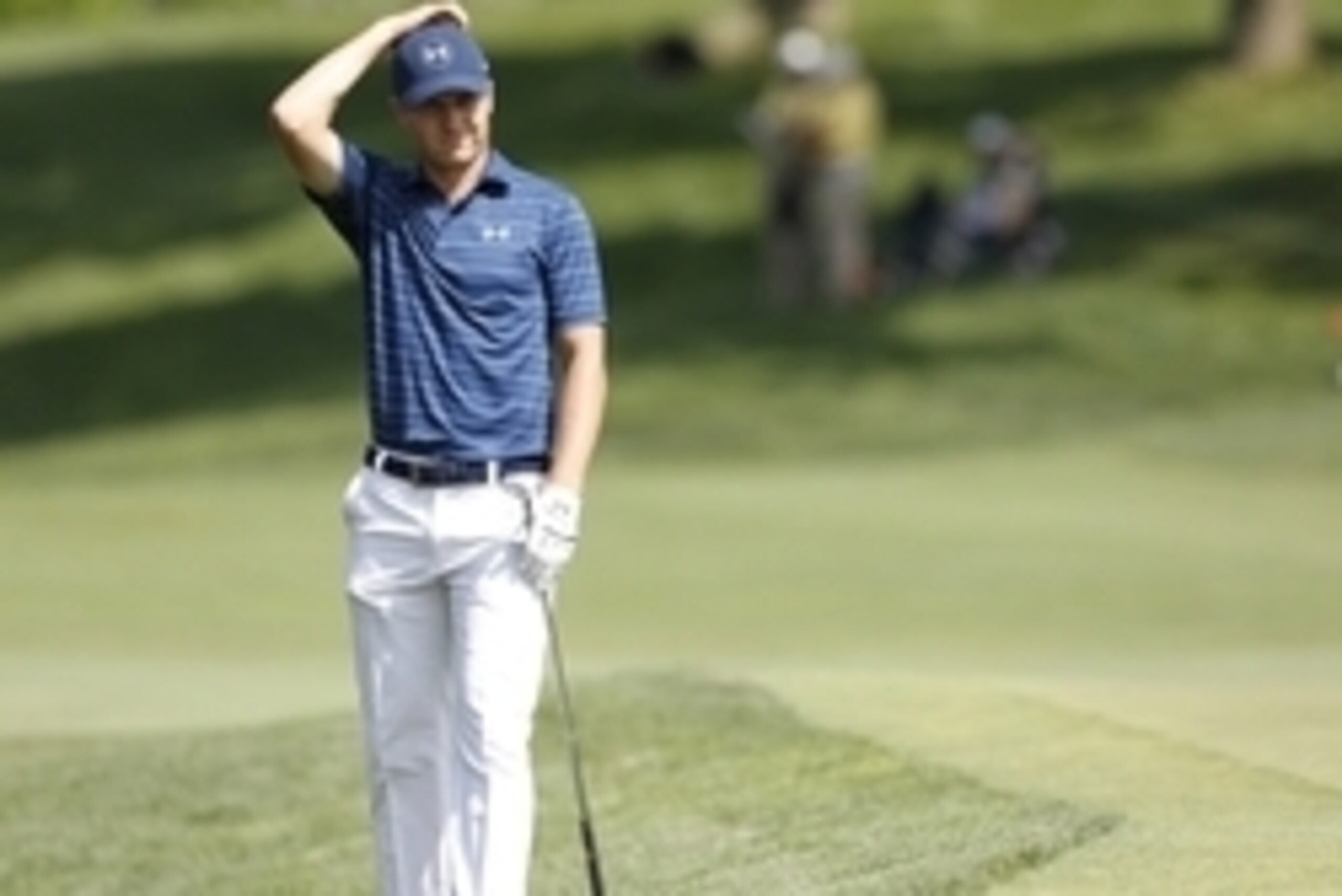 Jun 5, 2016; Dublin, OH, USA; Jordan Spieth reacts after hitting the ball onto the fourteenth hole during the final round of The Memorial Tournament at Muirfield Village Golf Club. Mandatory Credit: Joe Maiorana-USA TODAY Sports
