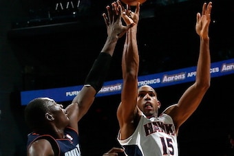 ATLANTA, GA - NOVEMBER 28:  Al Horford #15 of the Atlanta Hawks shoots against Bismack Biyombo #0 of the Charlotte Bobcats at Philips Arena on November 28, 2012 in Atlanta, Georgia.  NOTE TO USER: User expressly acknowledges and agrees that, by downloadin