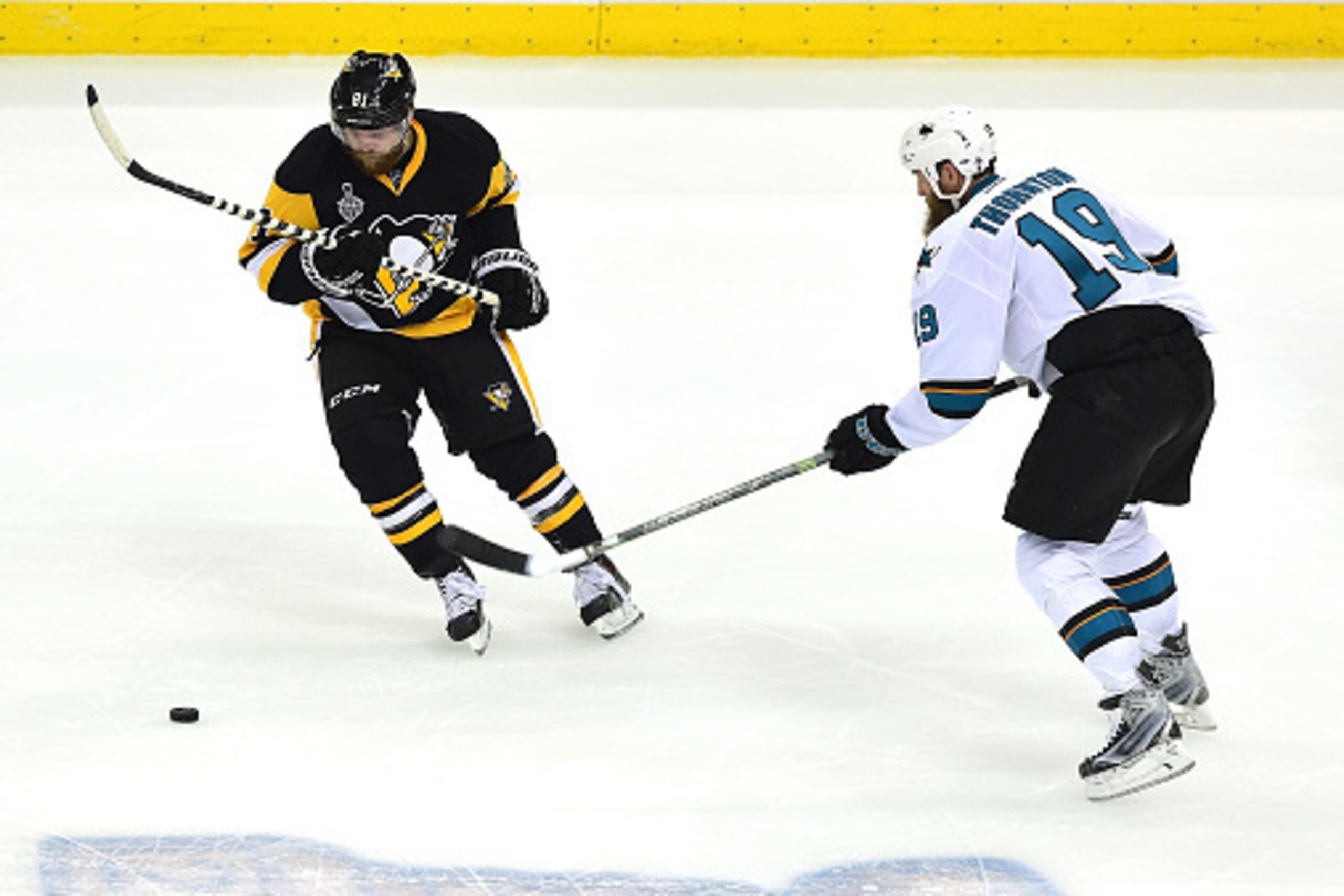PITTSBURGH, PA - JUNE 01:  Phil Kessel #81 of the Pittsburgh Penguins skates against Joe Thornton #19 of the San Jose Sharks during the first period in Game Two of the 2016 NHL Stanley Cup Final at Consol Energy Center on June 1, 2016 in Pittsburgh, Penns