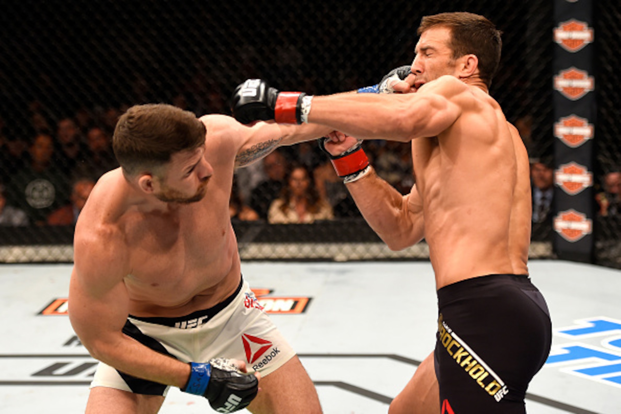 INGLEWOOD, CA - JUNE 04: Michael Bisping throws a left punch against Luke Rockhold in their UFC middleweight championship bout during the UFC 199 event at The Forum on June 4, 2016 in Inglewood, California.  (Photo by Josh Hedges/Zuffa LLC/Zuffa LLC via G