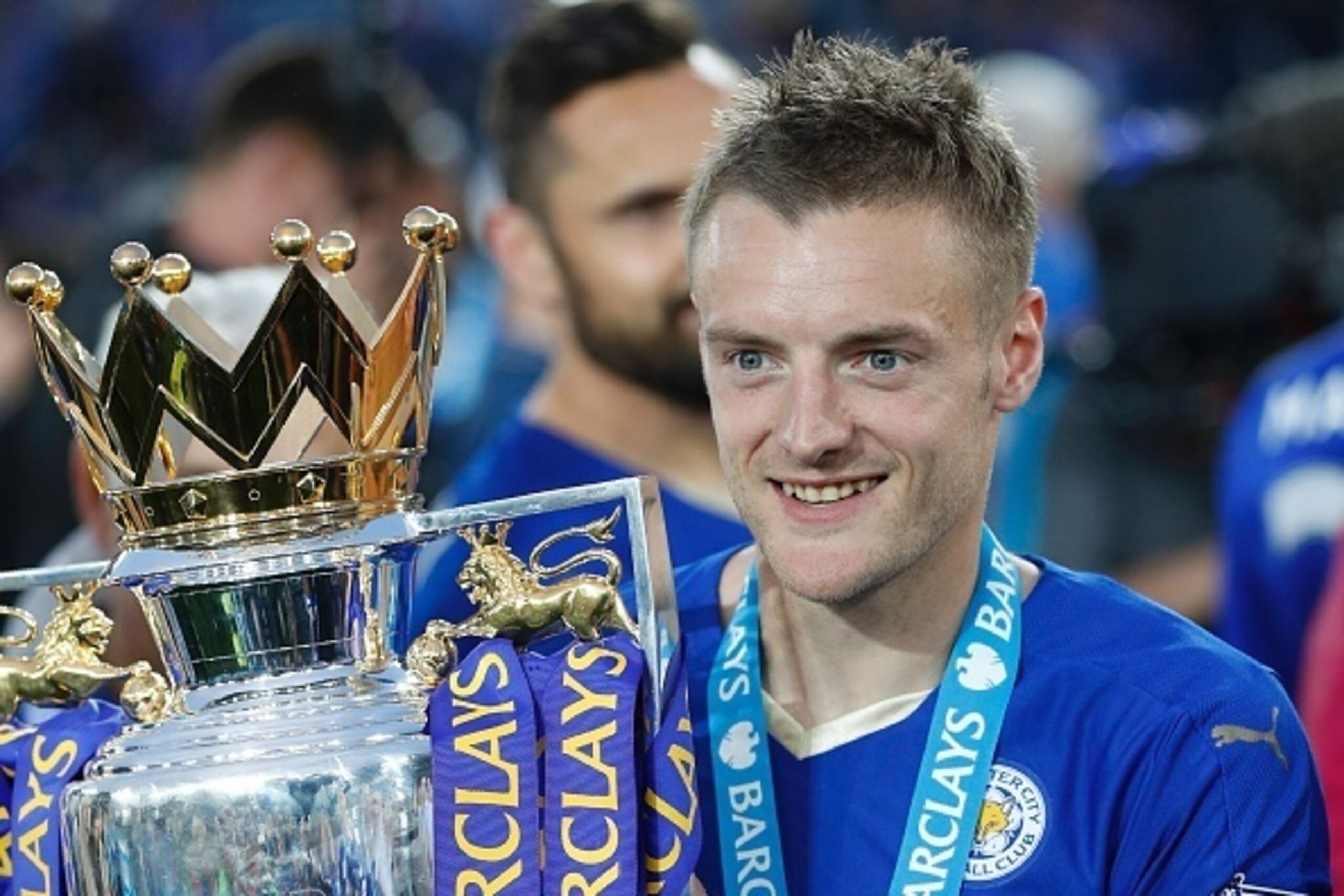Leicester City's English striker Jamie Vardy poses with the Premier league trophy after winning the league and the English Premier League football match between Leicester City and Everton at King Power Stadium in Leicester, central England on May 7, 2016.
