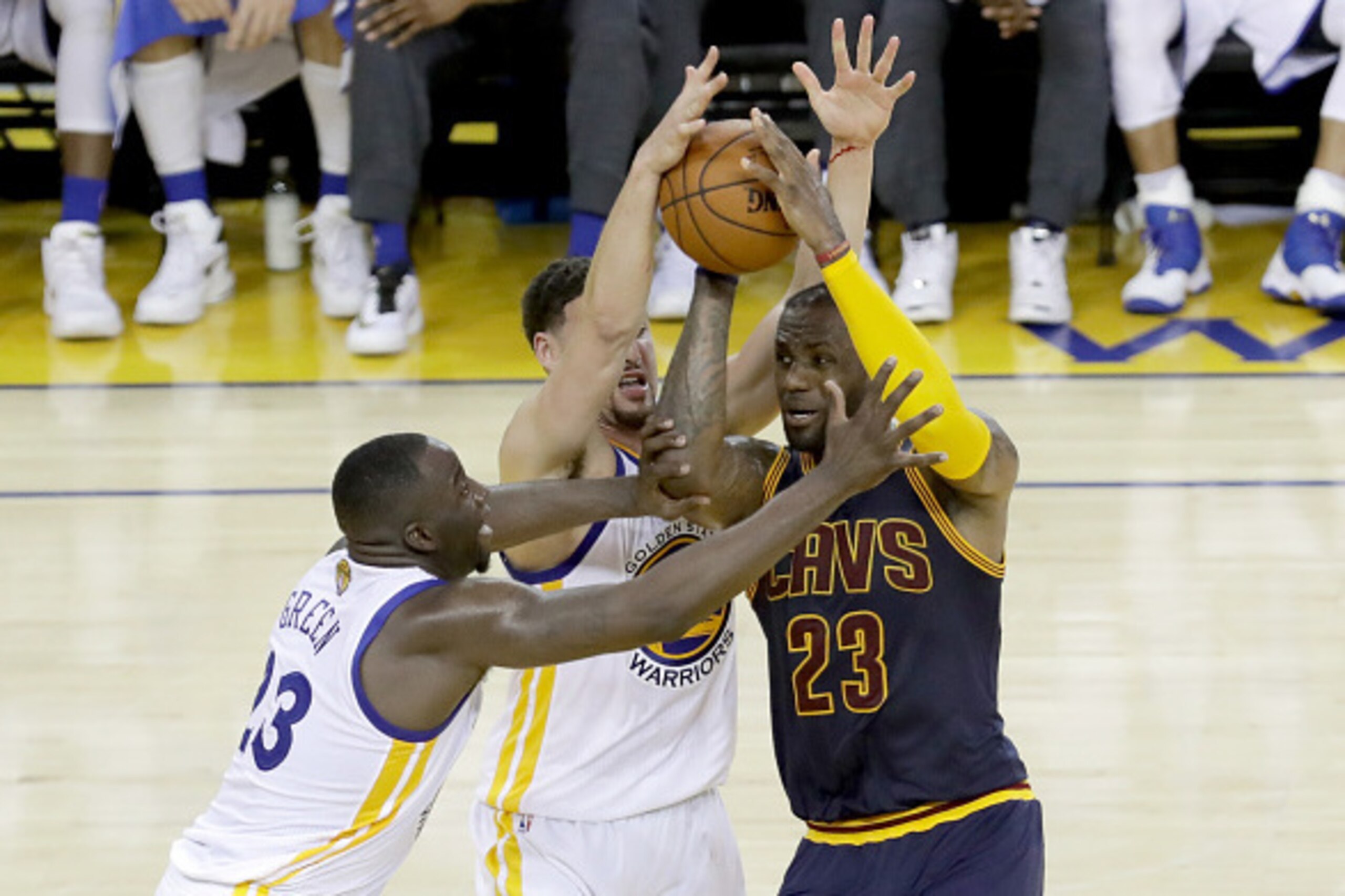 OAKLAND, CA - JUNE 05:  LeBron James #23 of the Cleveland Cavaliers with the ball against Draymond Green #23 and Klay Thompson #11 of the Golden State Warriors in the second half in Game 2 of the 2016 NBA Finals at ORACLE Arena on June 5, 2016 in Oakland,