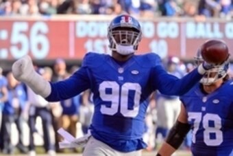 Dec 6, 2015; East Rutherford, NJ, USA; New York Giants defensive end Jason Pierre-Paul (90) celebrates after recovering a fumble during the first half against the New York Jets at MetLife Stadium. Mandatory Credit: Robert Deutsch-USA TODAY Sports